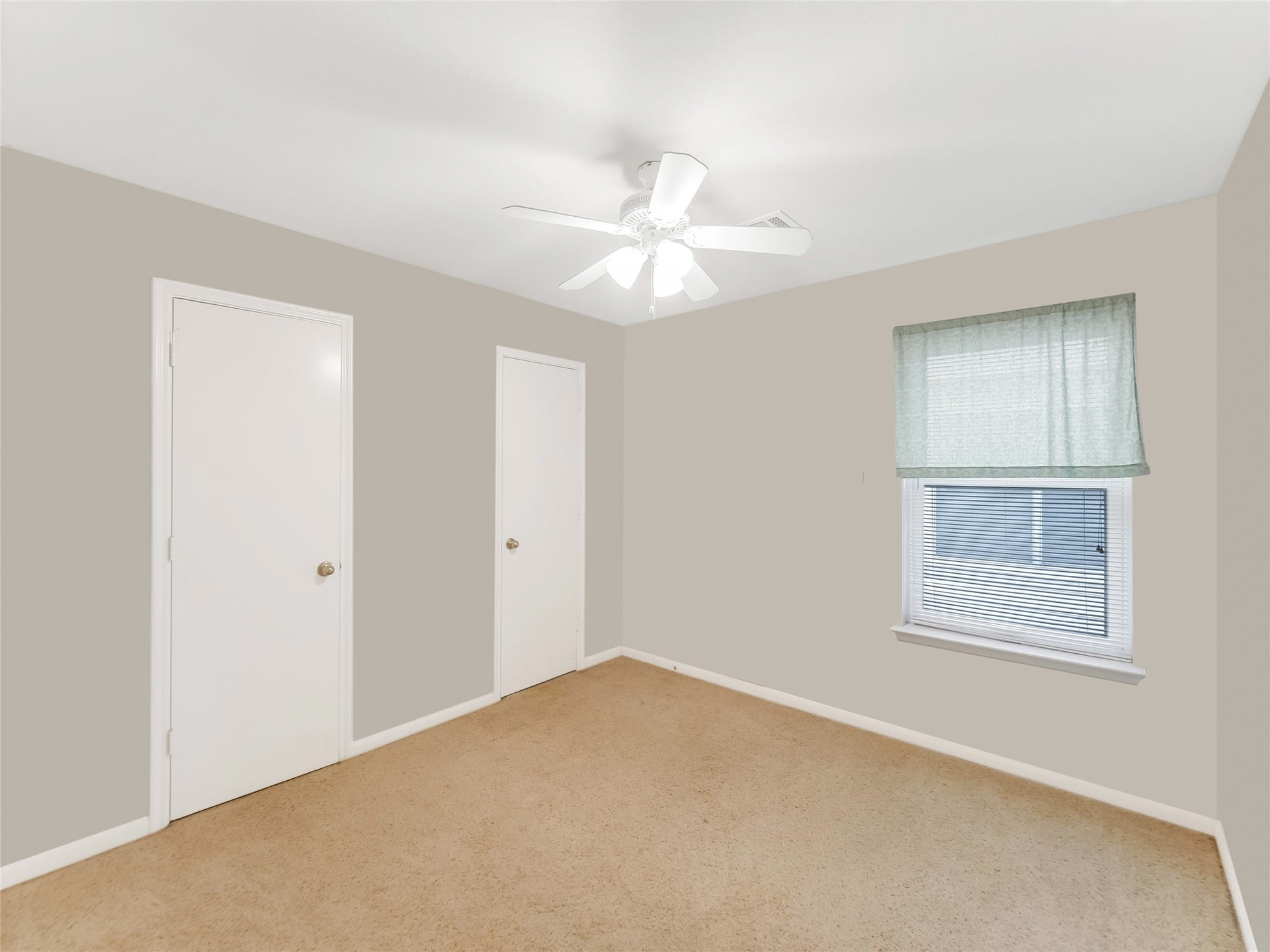 20911 Harvest Terrace Lane, Spring, TX 77379 Bedroom with a ceiling fan, and a large window.