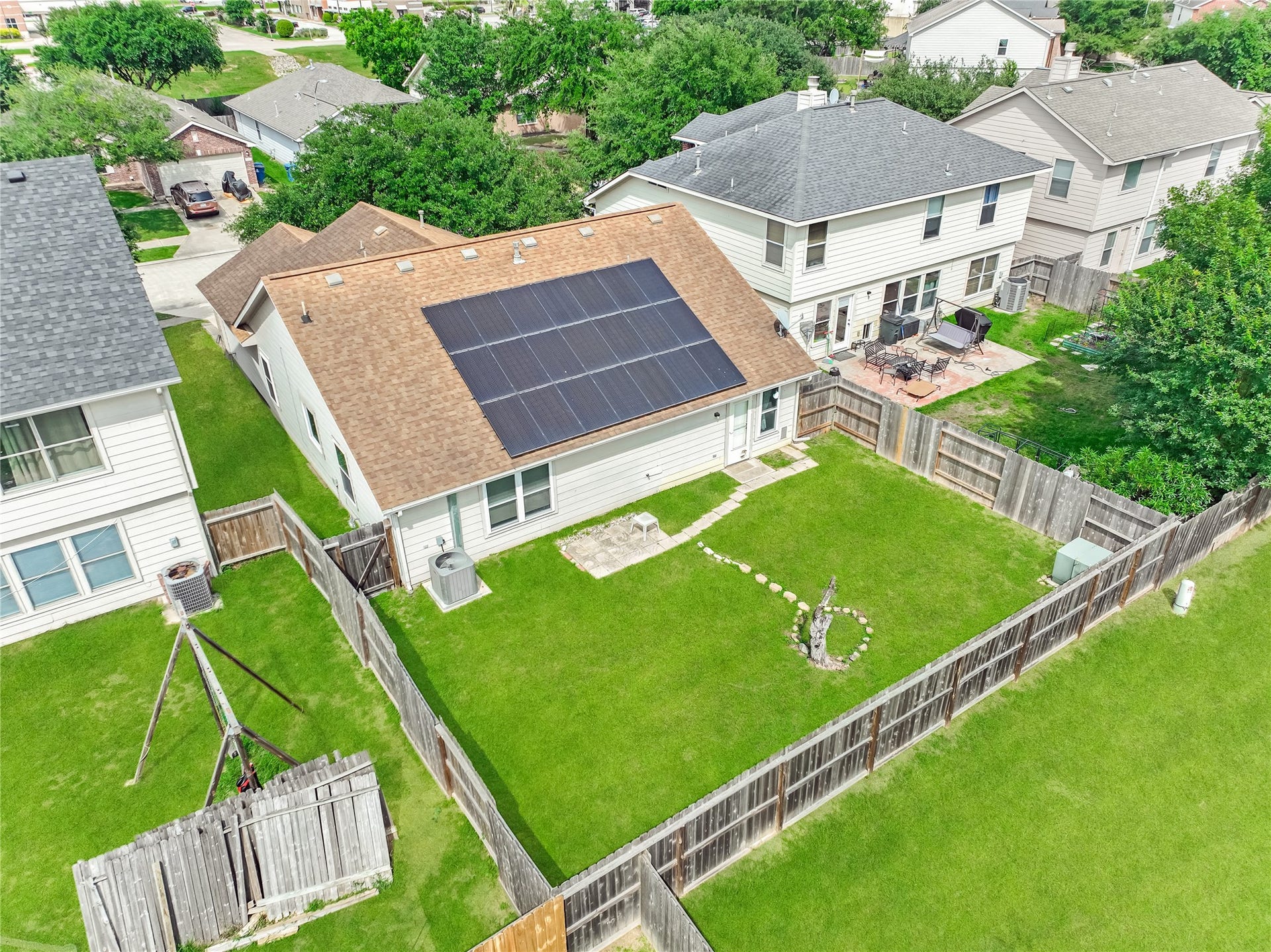 20911 Harvest Terrace Lane, Spring, TX 77379 Aerial view of the property showing the house, backyard, surrounding homes, and nearby streets.