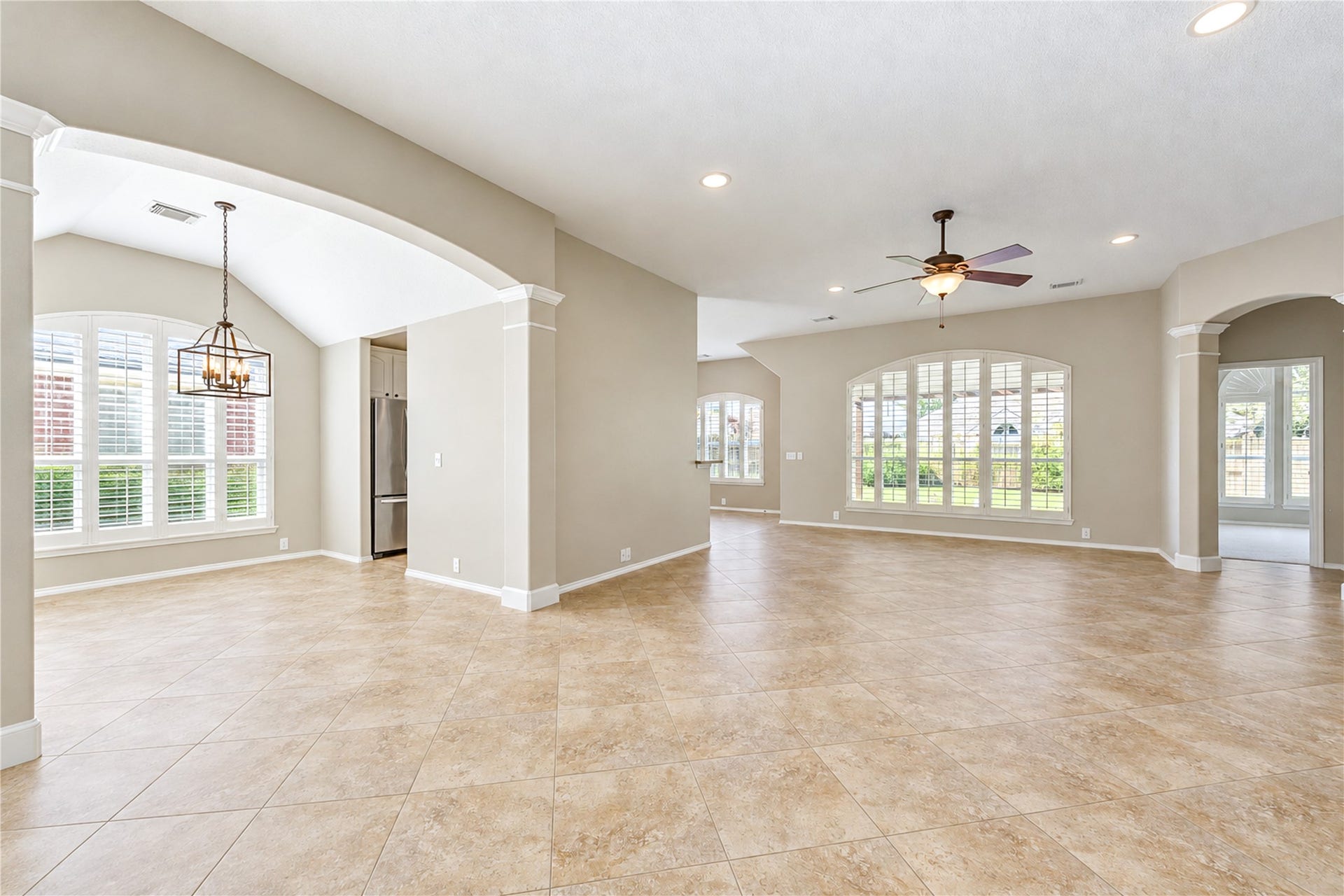 Open access to the dining room, kitchen, and breakfast area with beautiful windows.