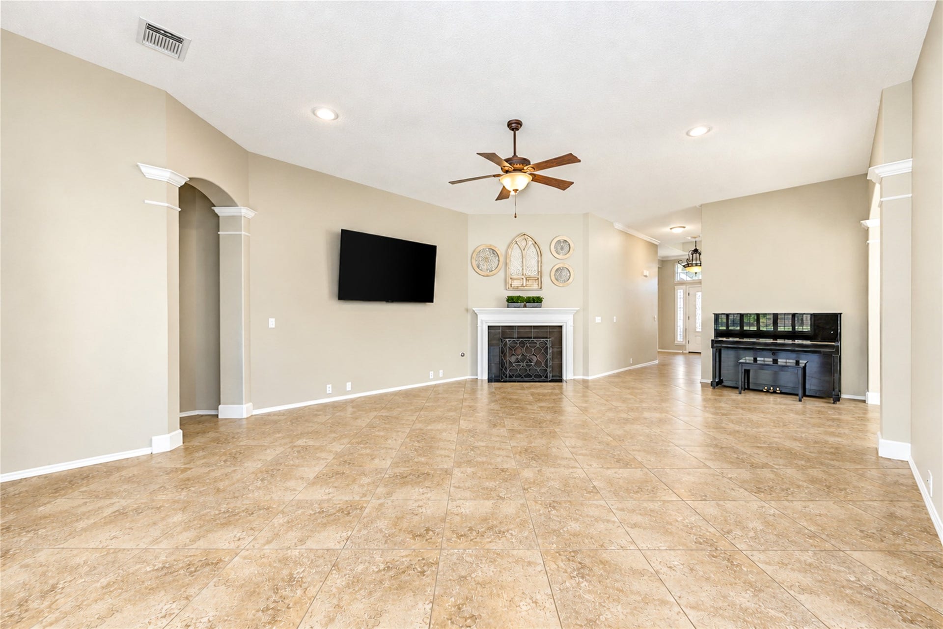 The living room is open to the kitchen, breakfast area, and dining room.