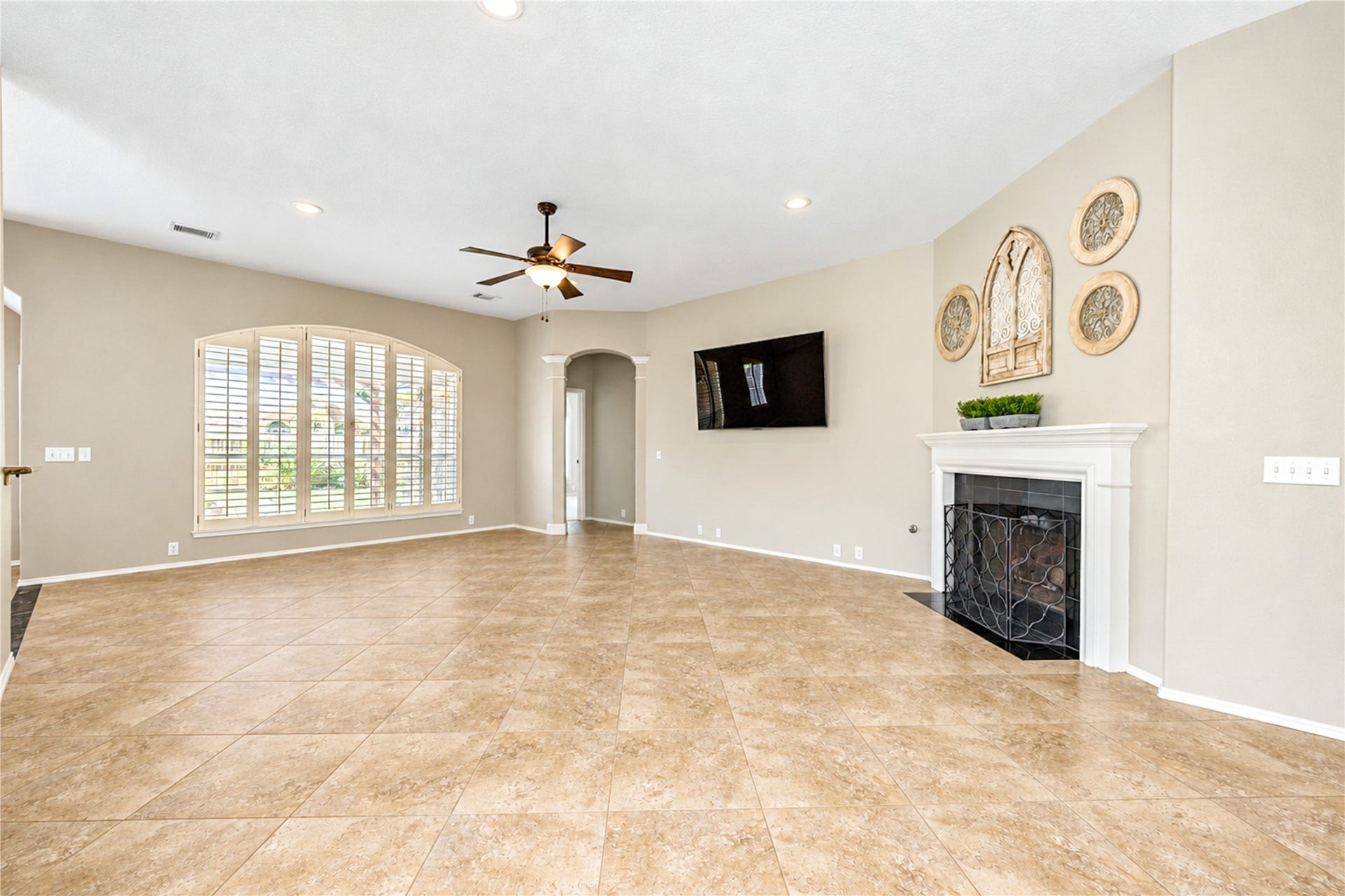 Warm up to the fireplace in this spacious living room.