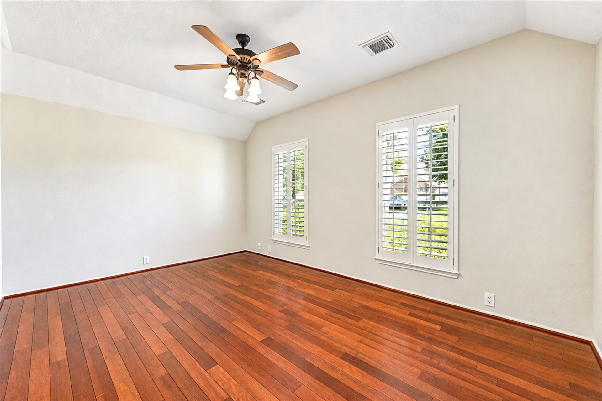 Beautifully designed home office with tall ceilings and natural lighting.