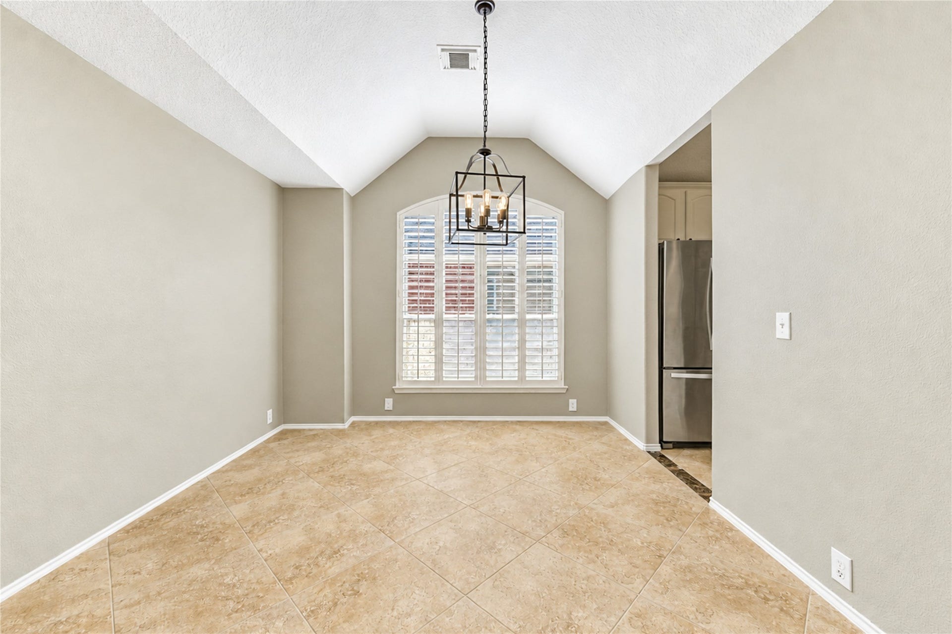 The dining room off of the living room and kitchen will fit a large table setting for entertaining or events.