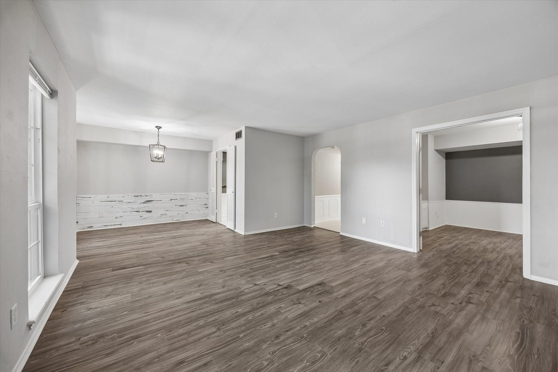 Huge living room with space for all your needs has open sight to dining