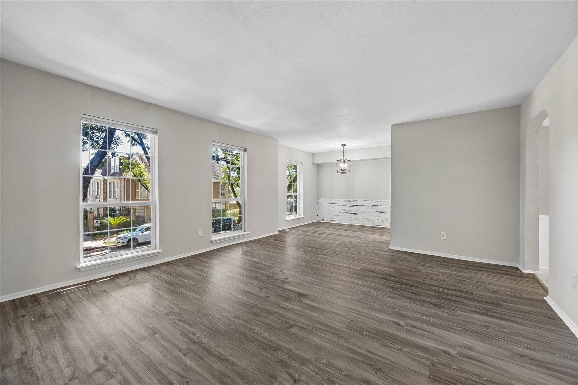 Huge living room with space for all your needs has open sight to dining
