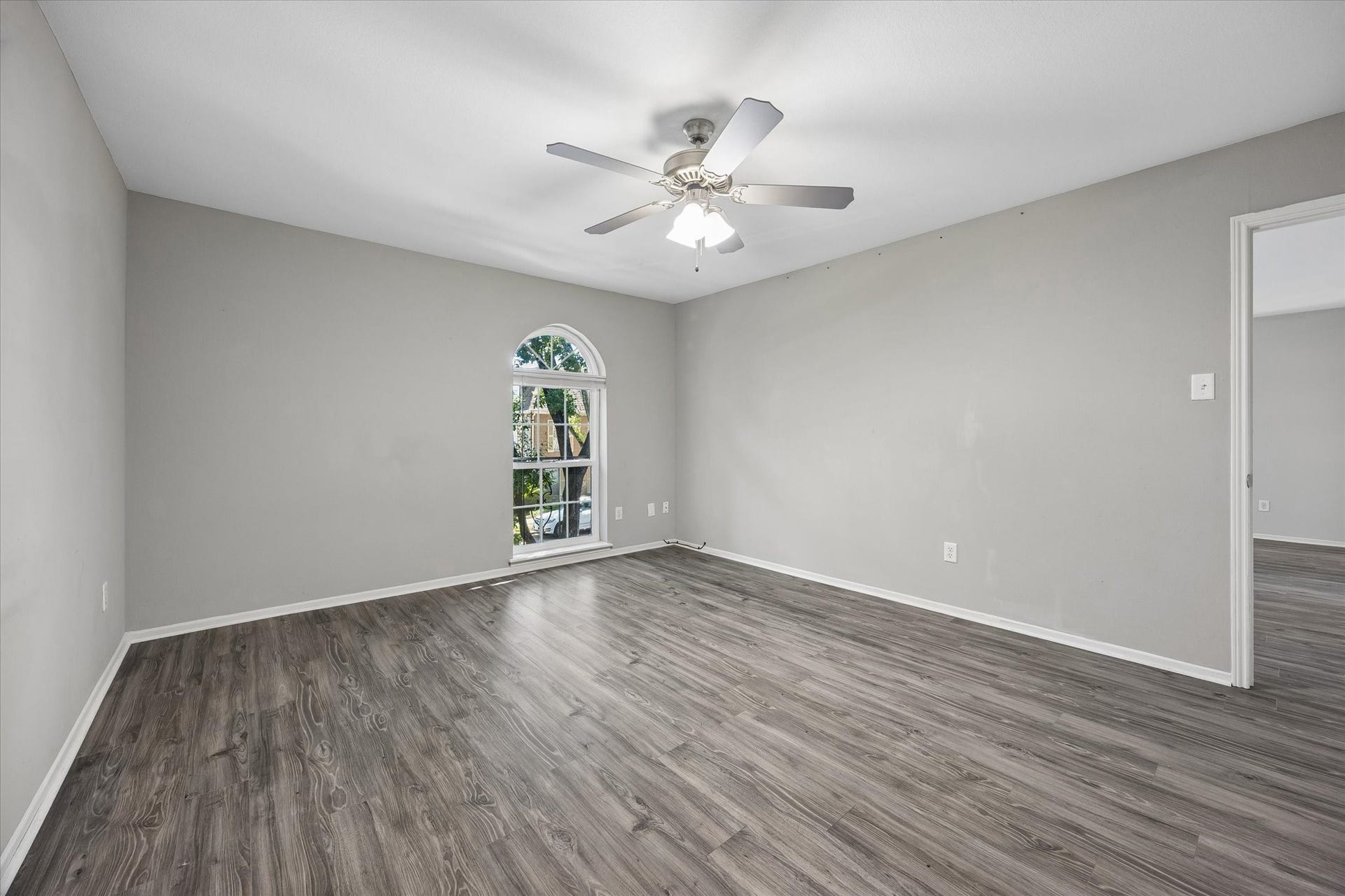 Primary bedroom is spacious with huge walk-in closet and access to the fully renovated bathroom.