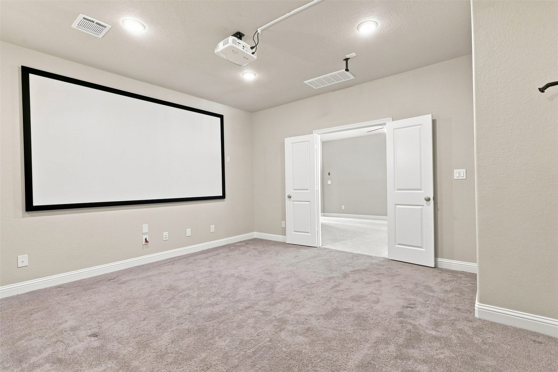 35 Gracenote Pl, The Woodlands, TX 77375 The media room includes projector and screen.