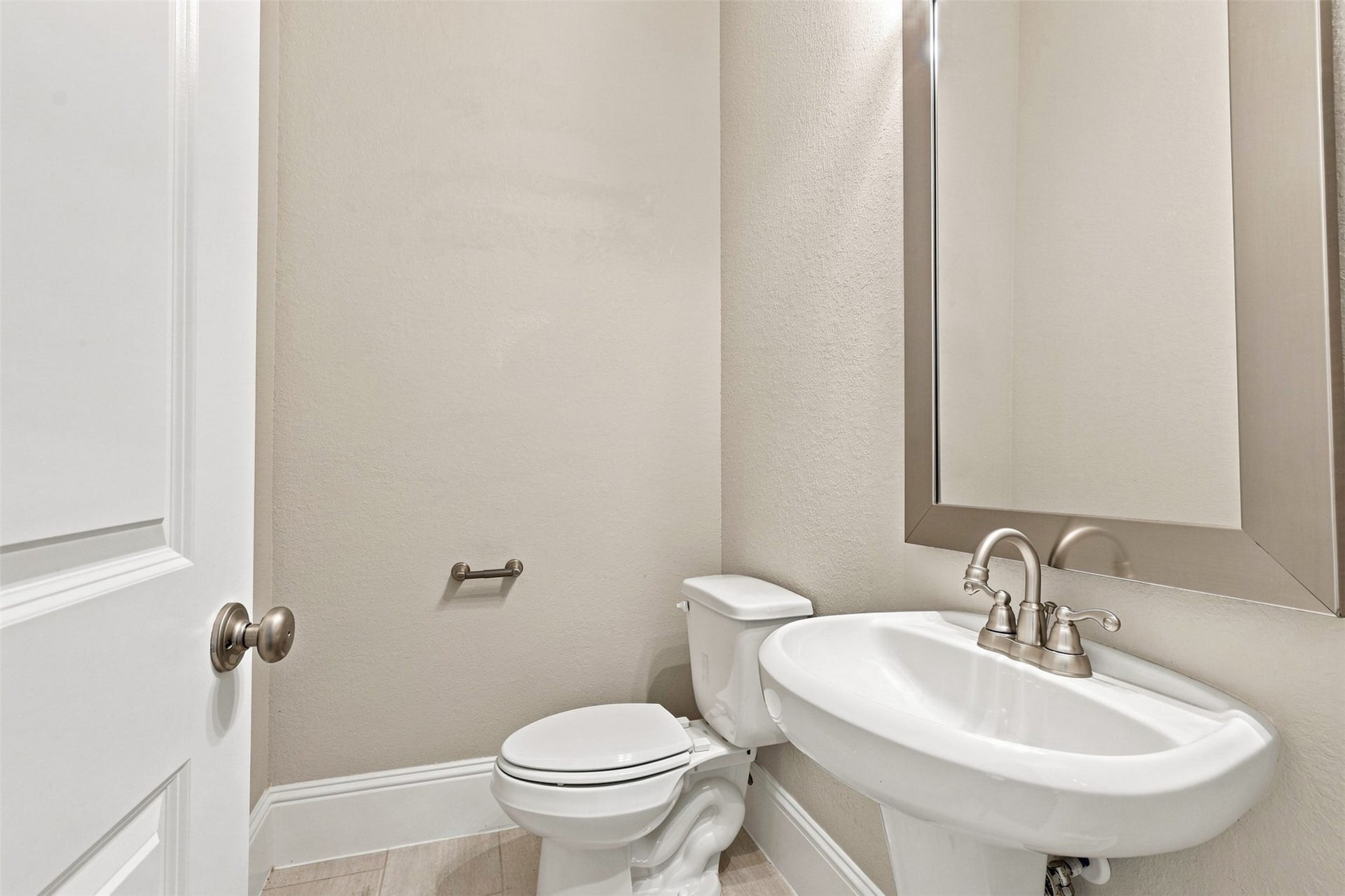 35 Gracenote Pl, The Woodlands, TX 77375 Powder room located on the main level.