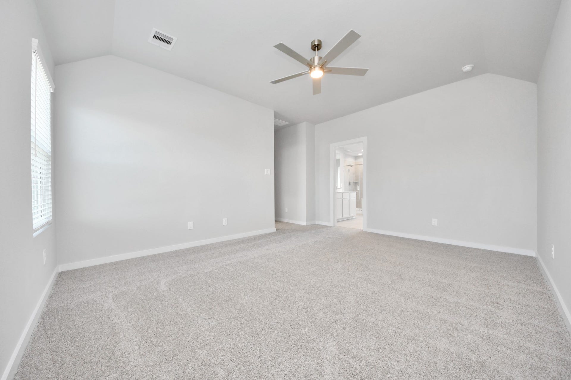 5826 Madison Trail Drive, Richmond, TX 77469 Come and unwind after a long day in this magnificent primary suite! This spacious room features plush carpet, warm paint, high ceilings and large windows with privacy blinds. Sample photo of completed home with similar floor plan. Actual colors and selections may vary.