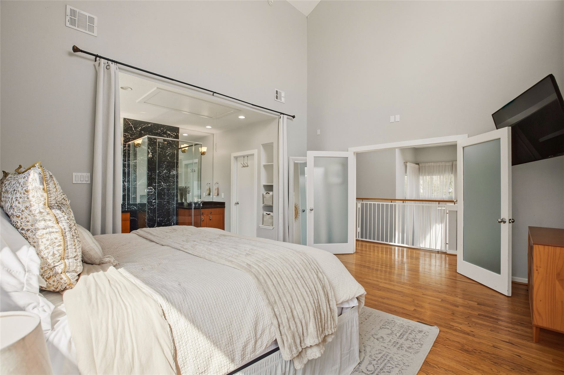 1803 Oneil Street, #C, Houston, TX 77019 Primary bedroom with French doors to a private balcony overlook.
