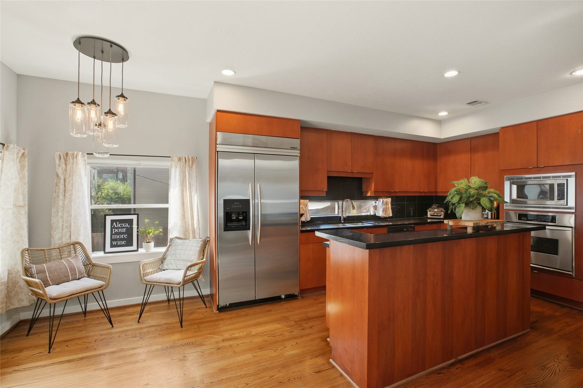 1803 Oneil Street, #C, Houston, TX 77019 Chef's kitchen with stainless appliances, a center island & a sunny breakfast nook.