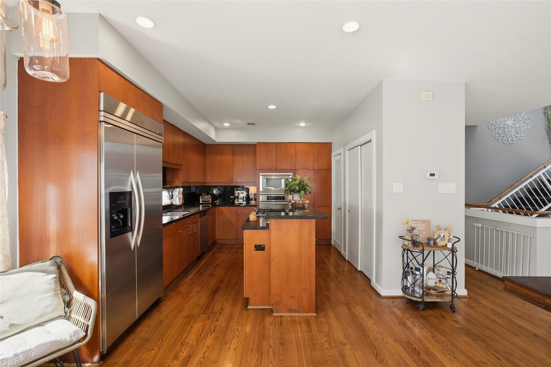 1803 Oneil Street, #C, Houston, TX 77019 Rich wood cabinetry, granite counters and a built-in oven & microwave.
