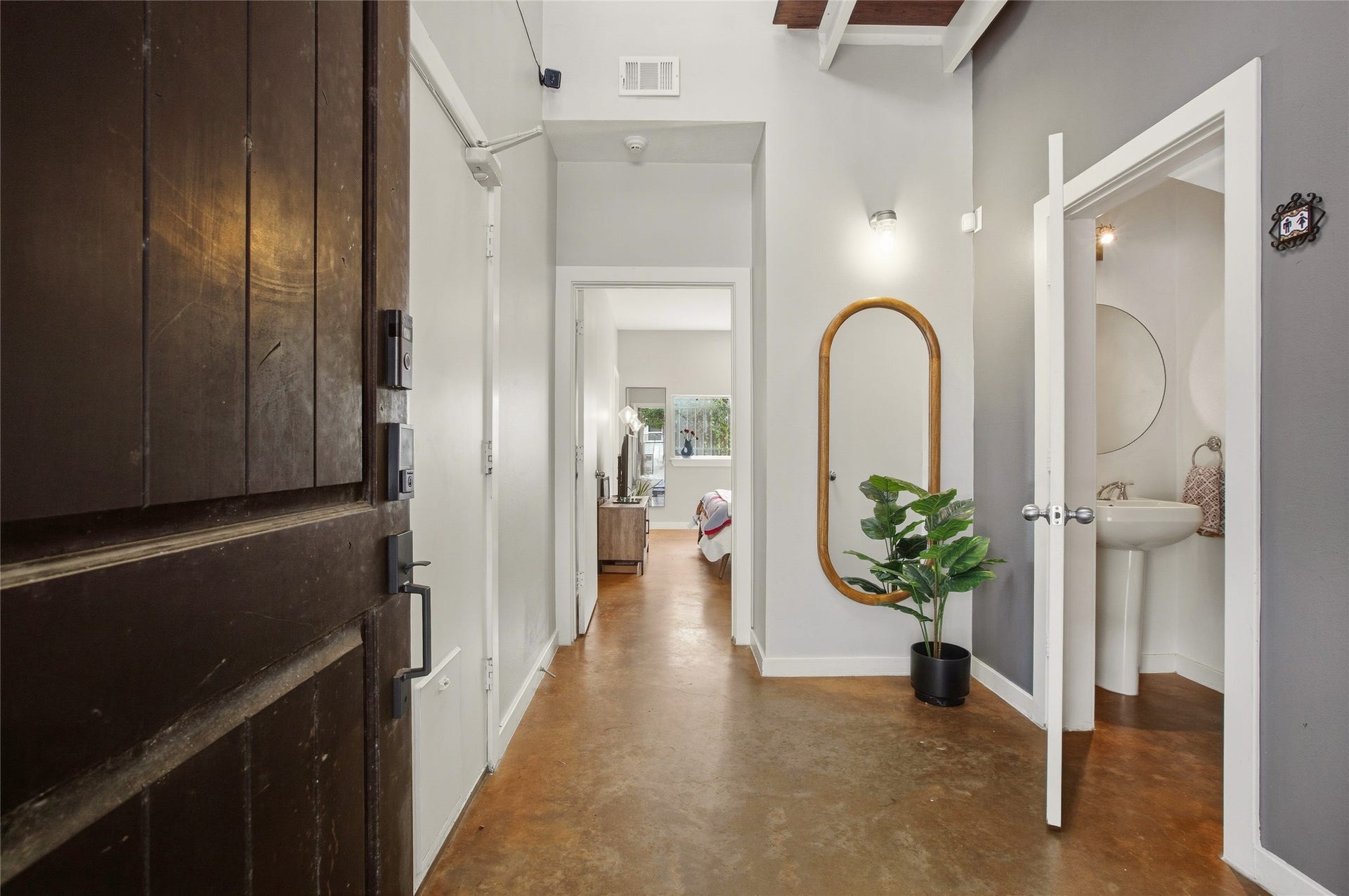 1803 Oneil Street, #C, Houston, TX 77019 Bright entry with stained concrete floors and a convenient powder room.