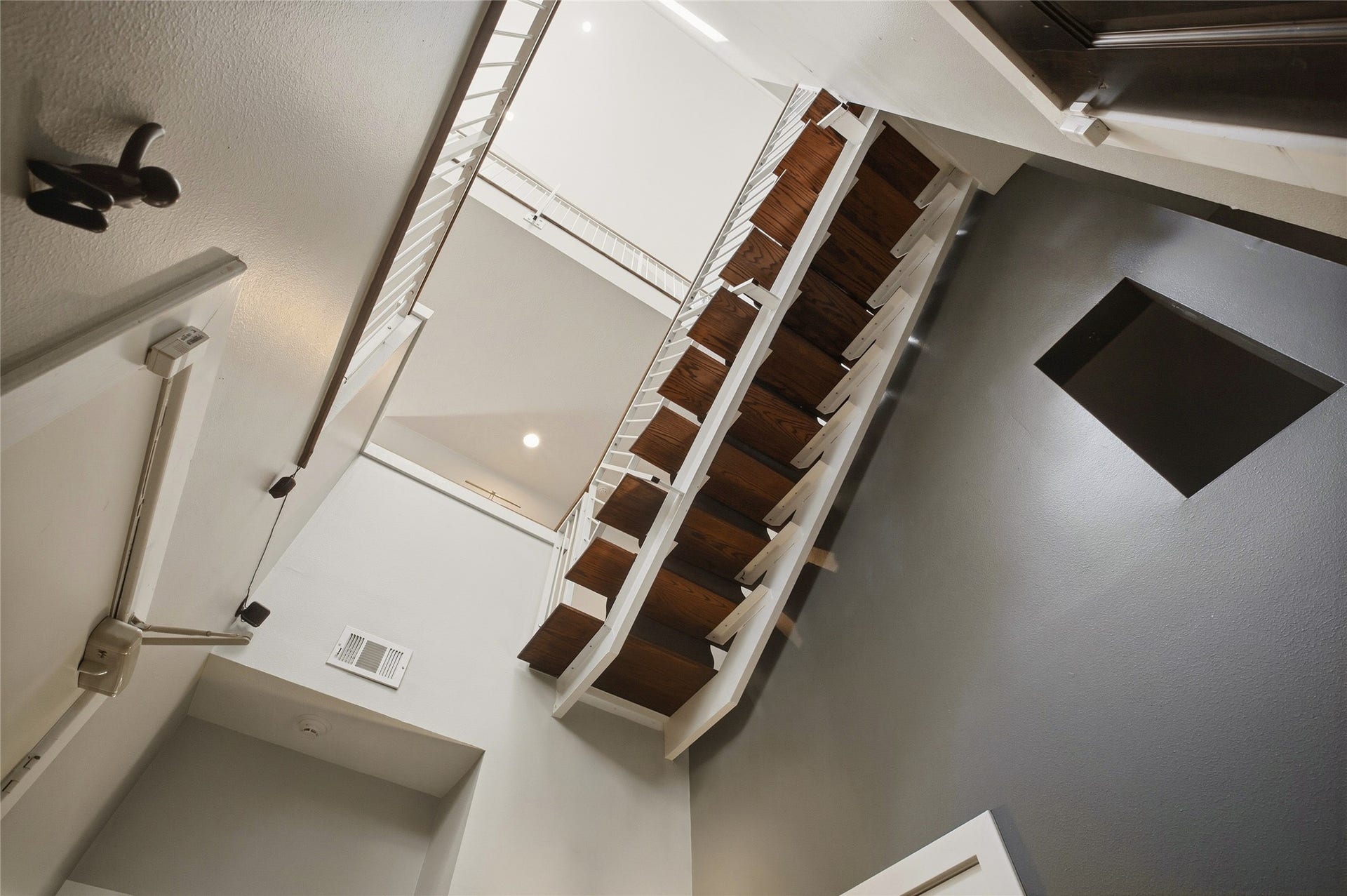 1803 Oneil Street, #C, Houston, TX 77019 Dramatic floating staircase rises through all three levels and the rooftop.
