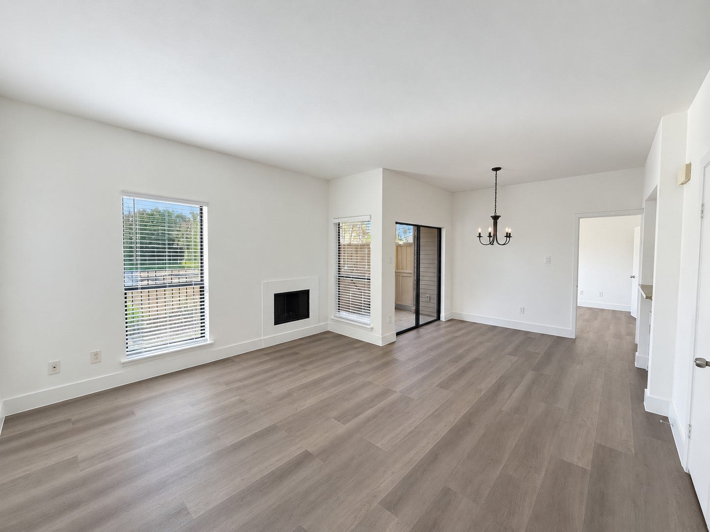 2025 Augusta Drive, #207, Houston, TX 77057 Living Room and Dining Room With Wood Burning Fire Place