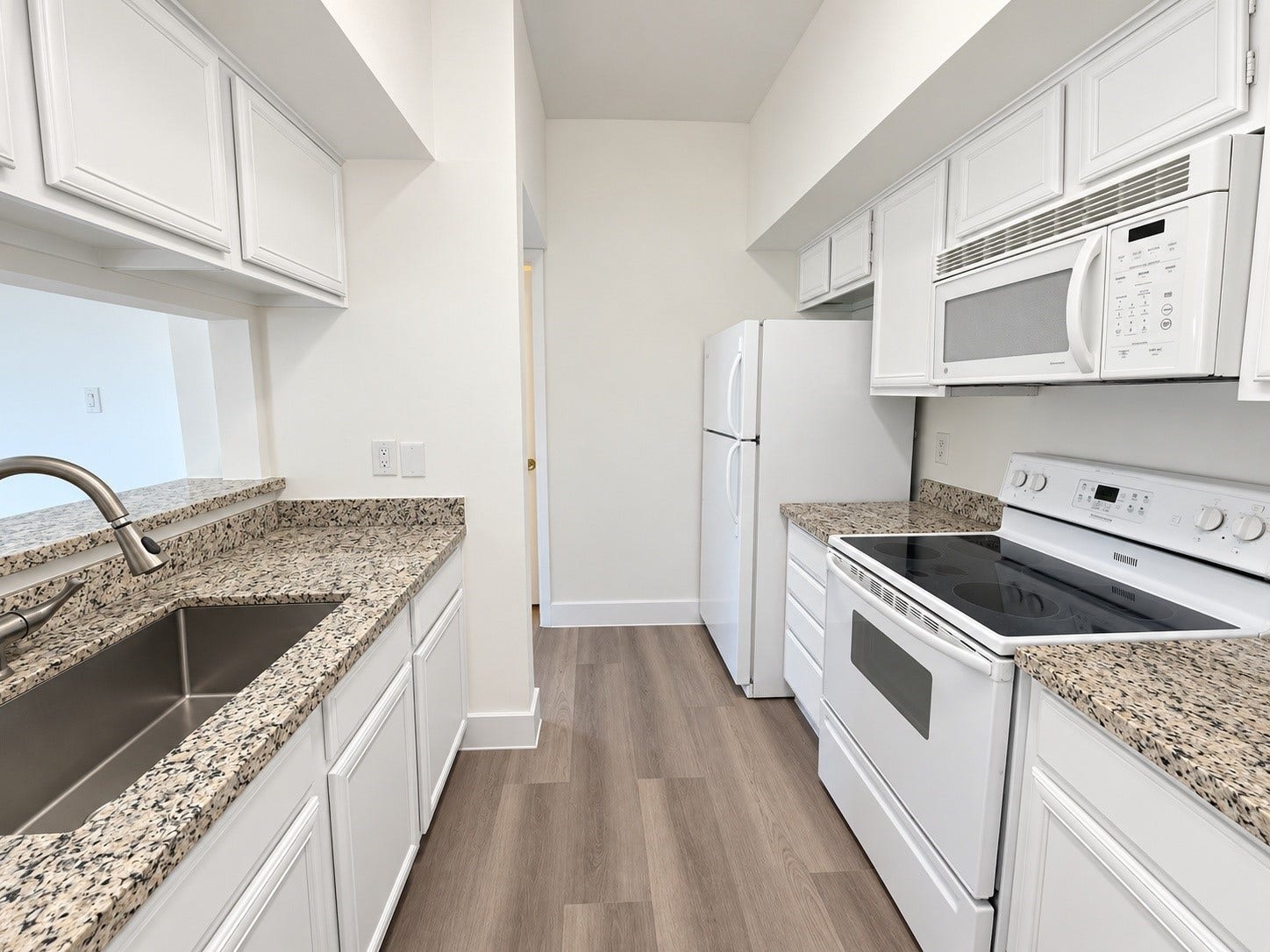2025 Augusta Drive, #207, Houston, TX 77057 Kitchen with granite counters