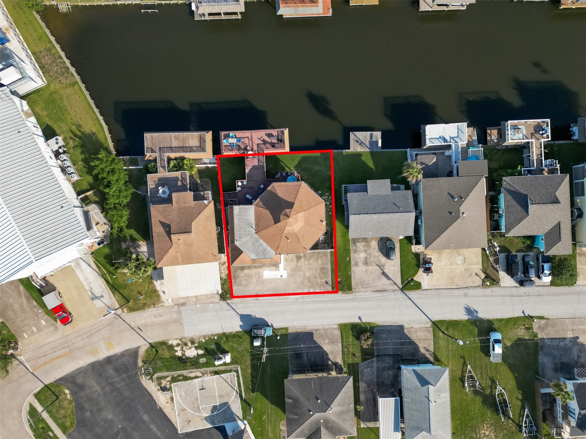 Top-down spatial orientation emphasizing the property's footprint, iconic roofline, and generous 75-foot shoreline parcel.
