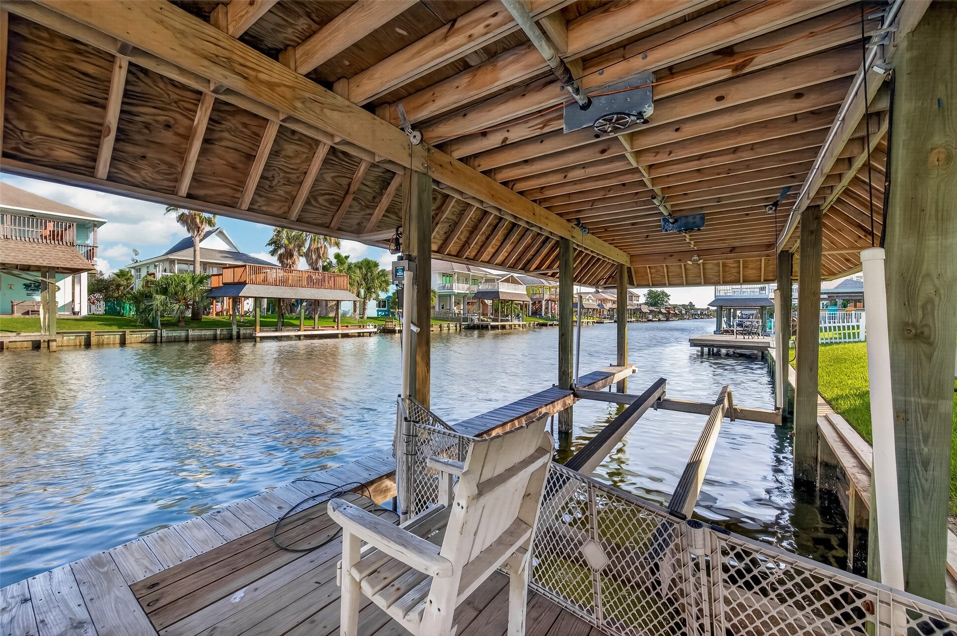 A nautical enthusiast's dreamfeaturing a massive 40-foot deep-water boathouse ready for quick, effortless access to open bay waters.