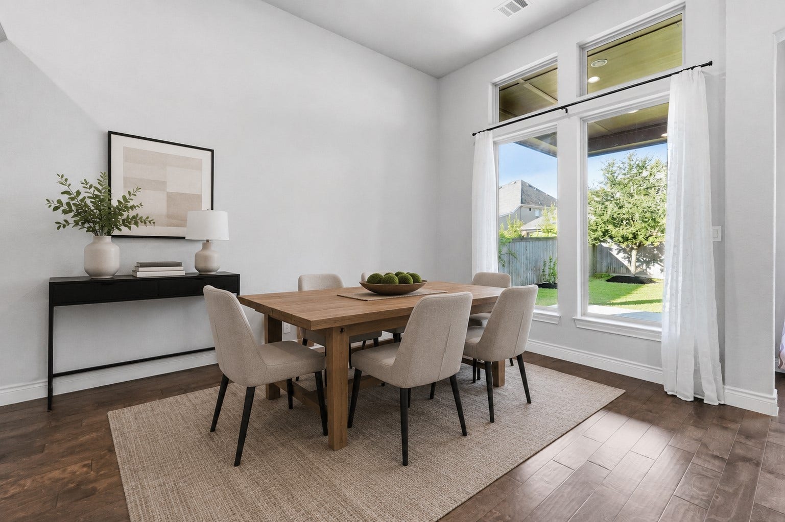 15223 Prairie Dog Town Lane, Cypress, TX 77433 (Virtually staged) Spacious dining area featuring expansive windows, engineered hardwood flooring, and natural light.