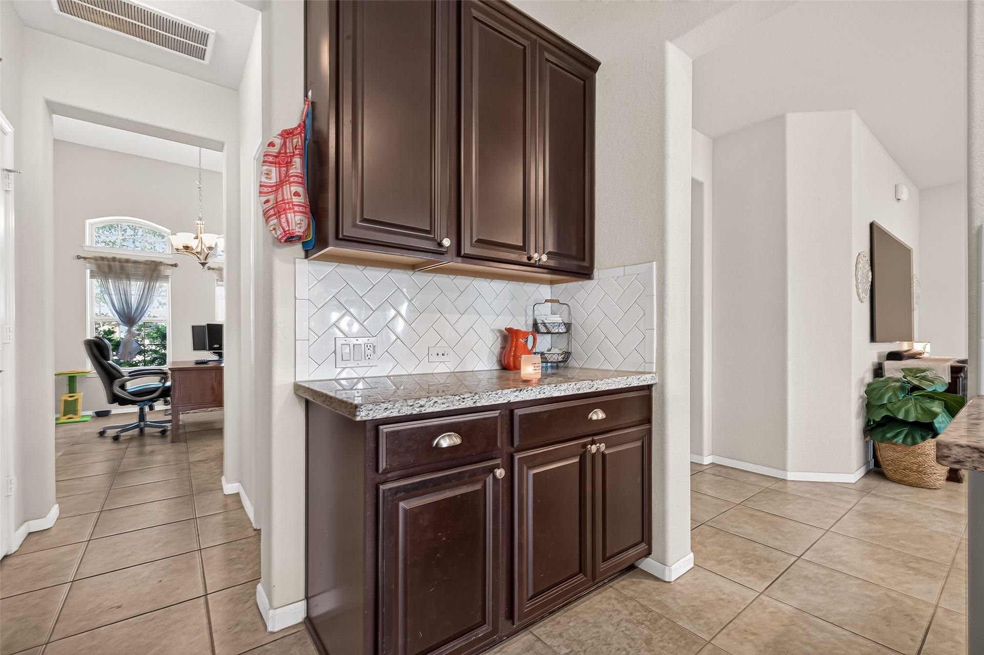 6111 Wayne Way, Rosenberg, TX 77471 Additional counter space and cabinetry provide a convenient spot for coffee or serving.