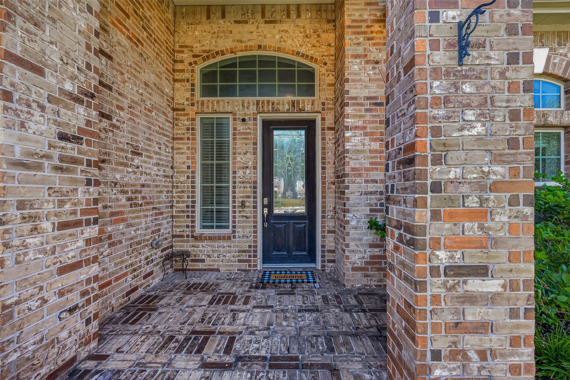 6111 Wayne Way, Rosenberg, TX 77471 A sheltered brick porch creates a welcoming entrance for you and your guests.