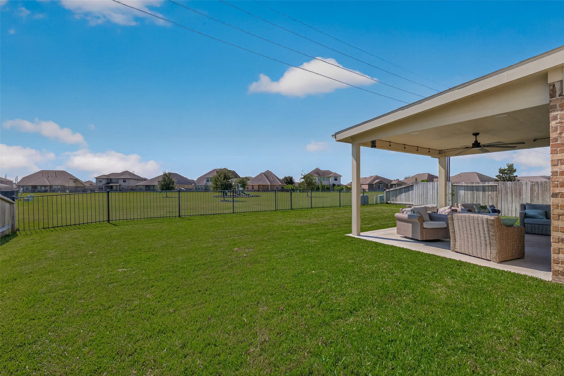 6111 Wayne Way, Rosenberg, TX 77471 A fenced backyard and covered patio provide room to enjoy the outdoors at 6111 Wayne Way.