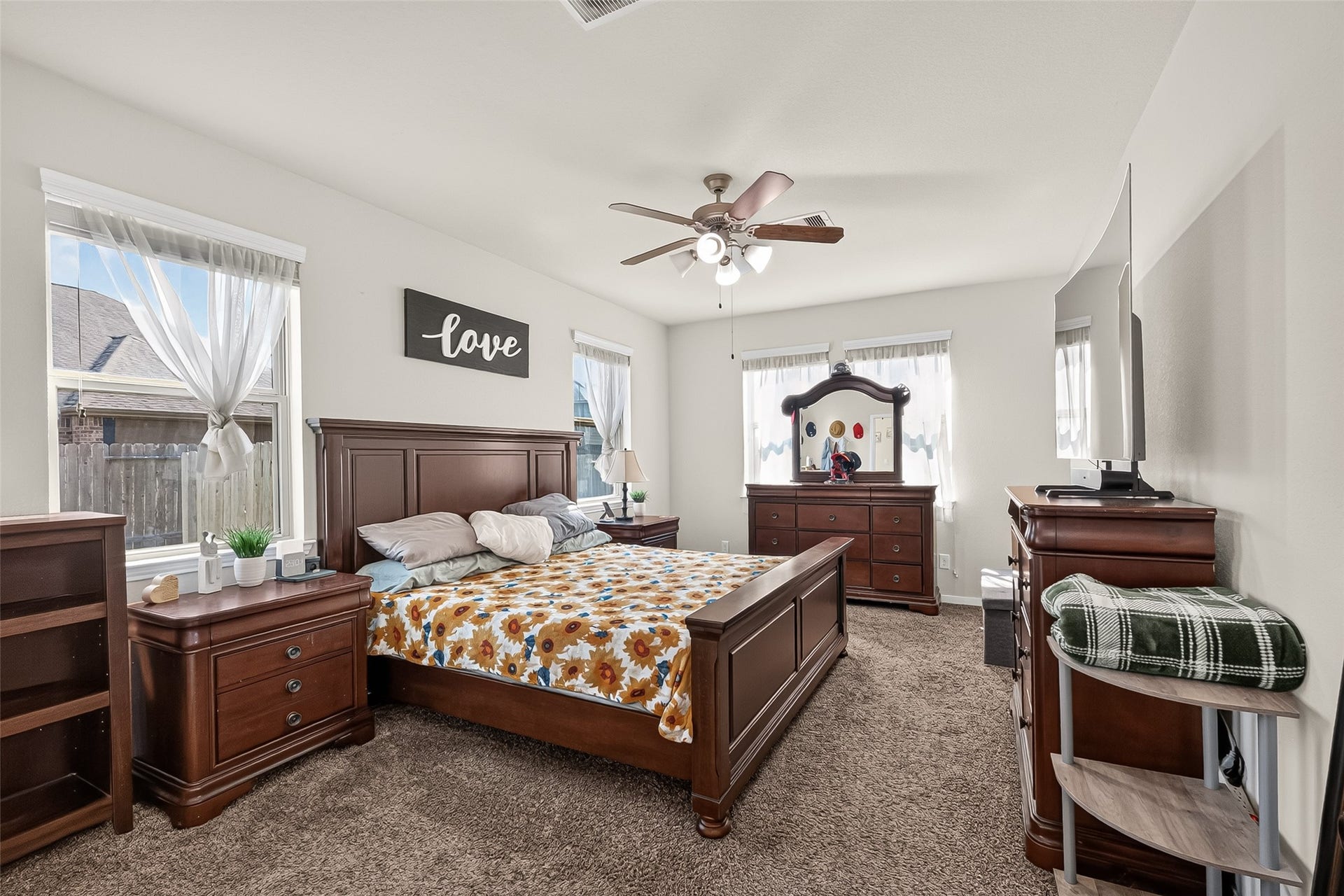 6111 Wayne Way, Rosenberg, TX 77471 The downstairs primary bedroom offers a spacious layout and plenty of natural light.