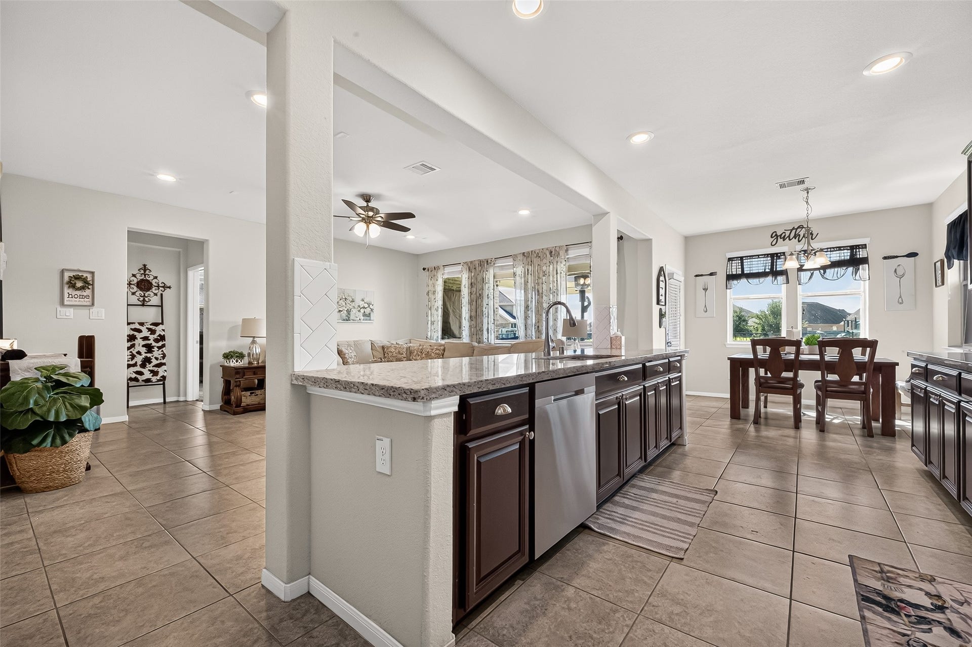 6111 Wayne Way, Rosenberg, TX 77471 An extended breakfast bar connects the kitchen with the home's open living spaces.