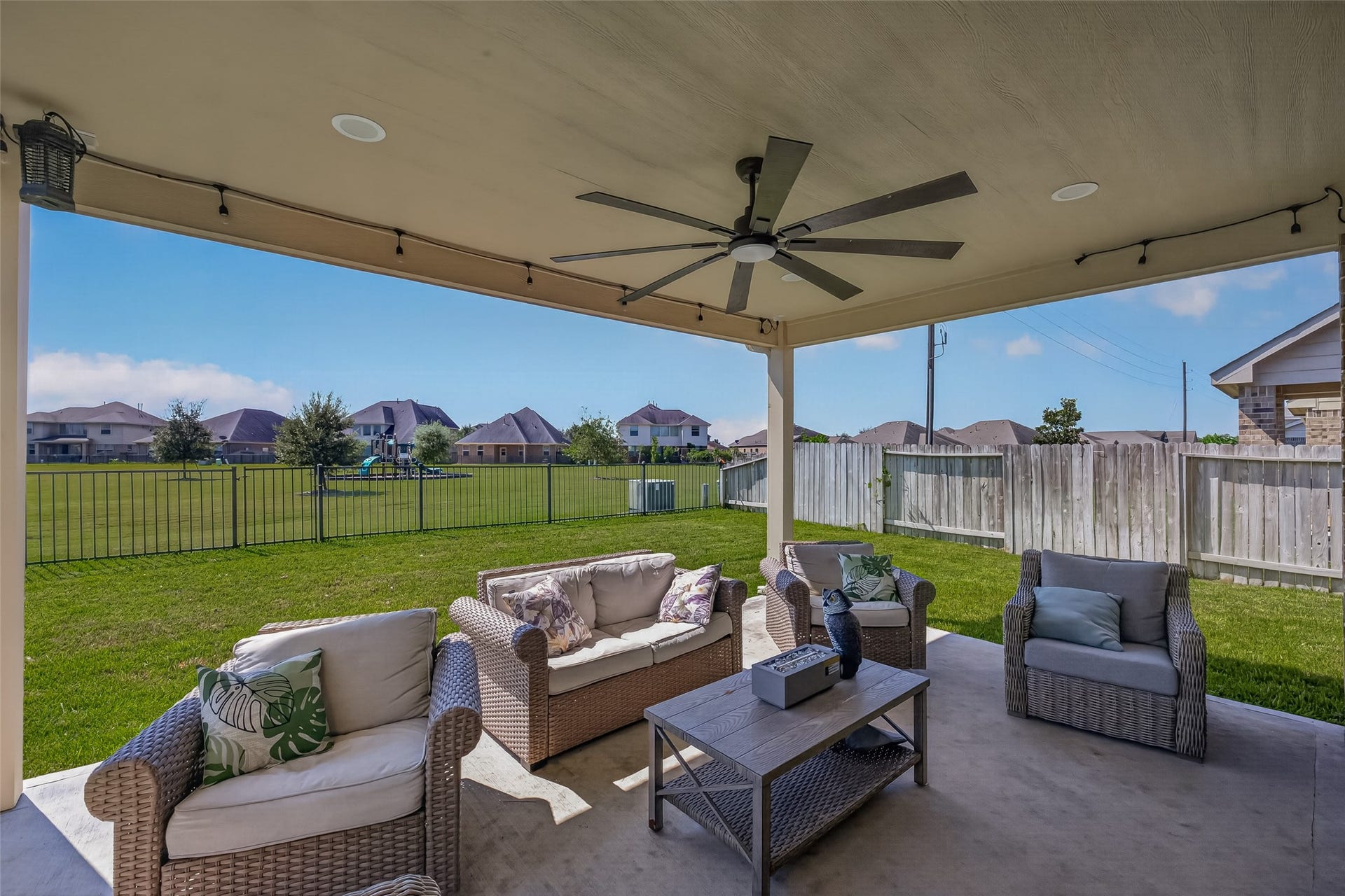 6111 Wayne Way, Rosenberg, TX 77471 A spacious patio creates another gathering spot overlooking the fenced yard.