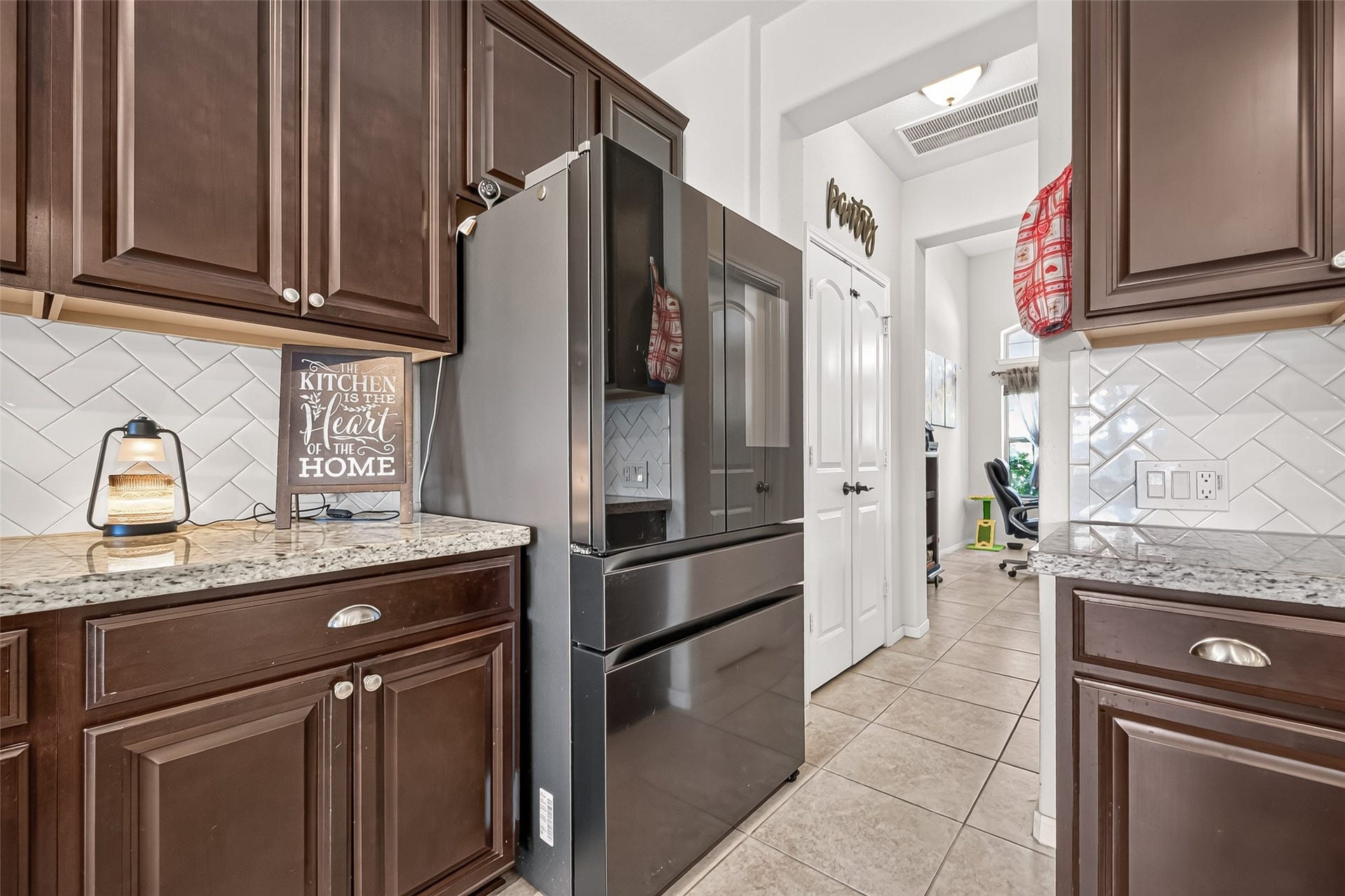 6111 Wayne Way, Rosenberg, TX 77471 The kitchen offers coordinated appliances and easy access to adjacent living areas.