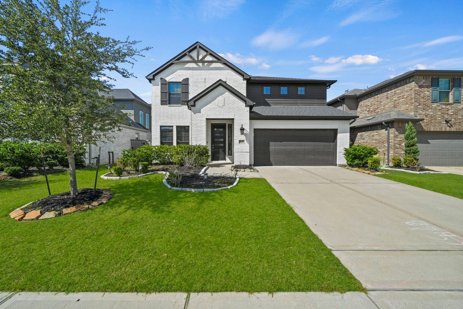9231 Dearborn Knoll Drive, Cypress, TX 77433 Welcome home to 9231 Dearborn Knoll Drive! White brick, dark accents, and a modern front door make a great first impression.