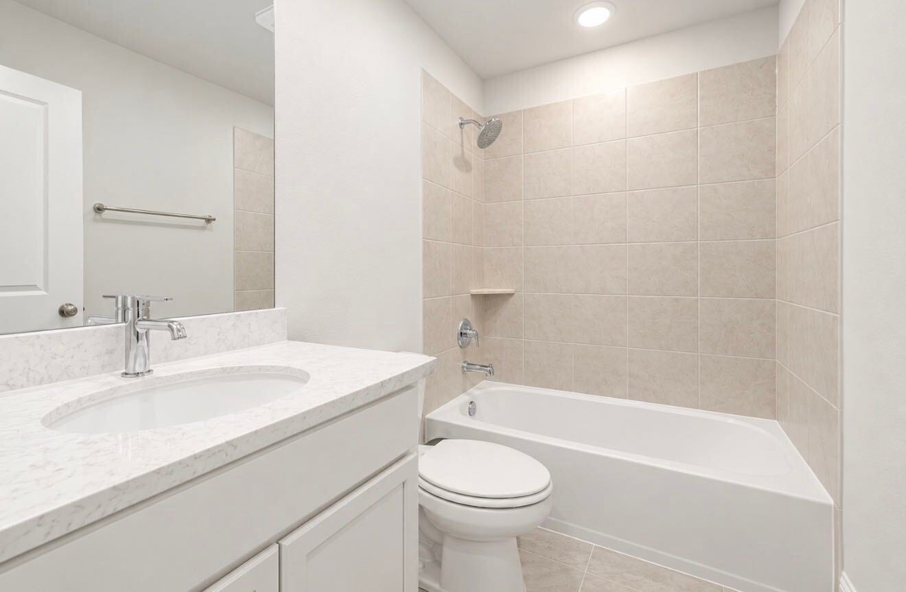 9231 Dearborn Knoll Drive, Cypress, TX 77433 One of the full secondary bathroom upstairs.