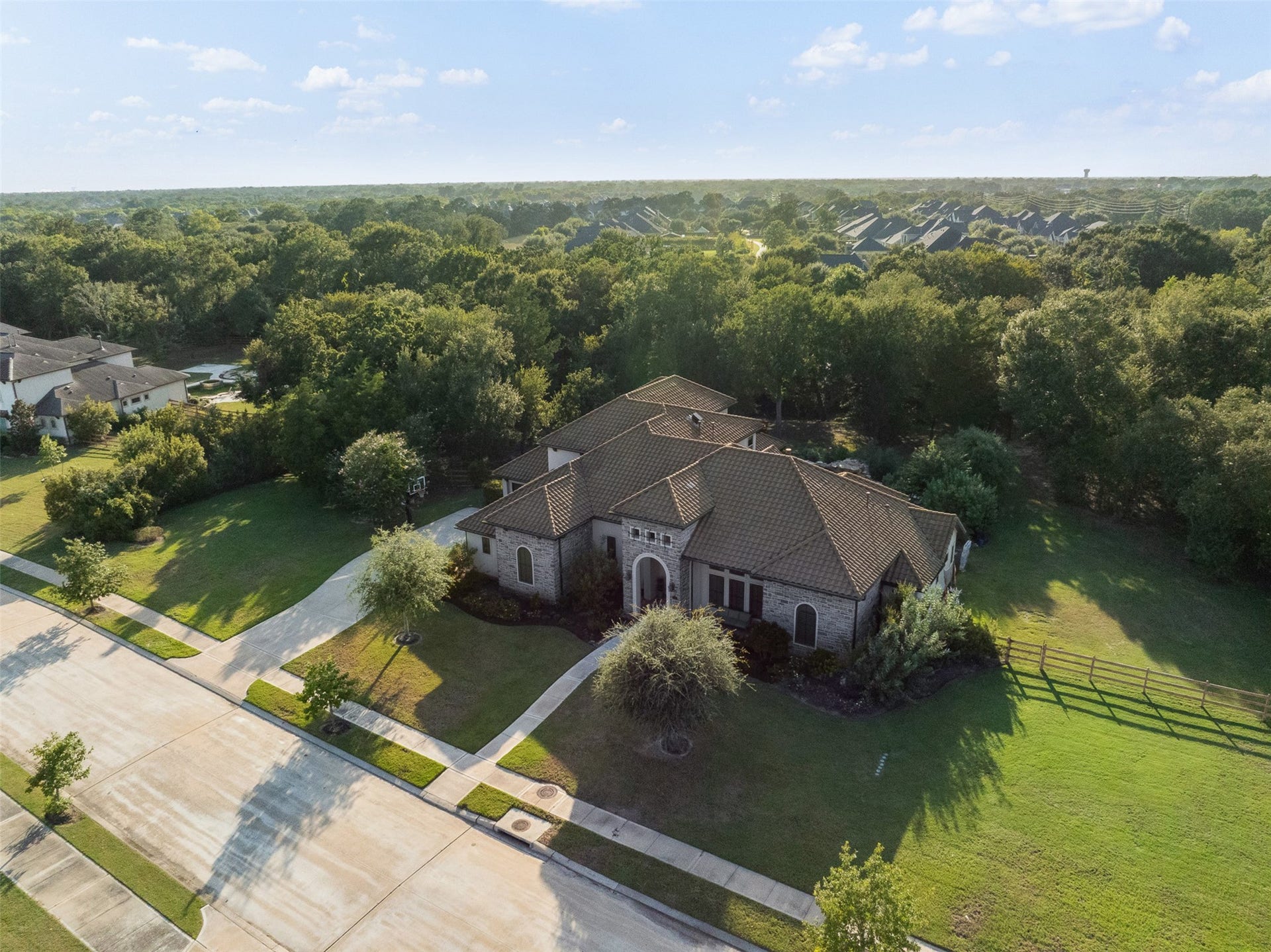 8603 Woods Hollow Trail, Fulshear, TX 77406 1.3 acres surrounded by trees on a quiet cul-de-sac. No additional development behind the property as homes are already built on the other side of the creek.