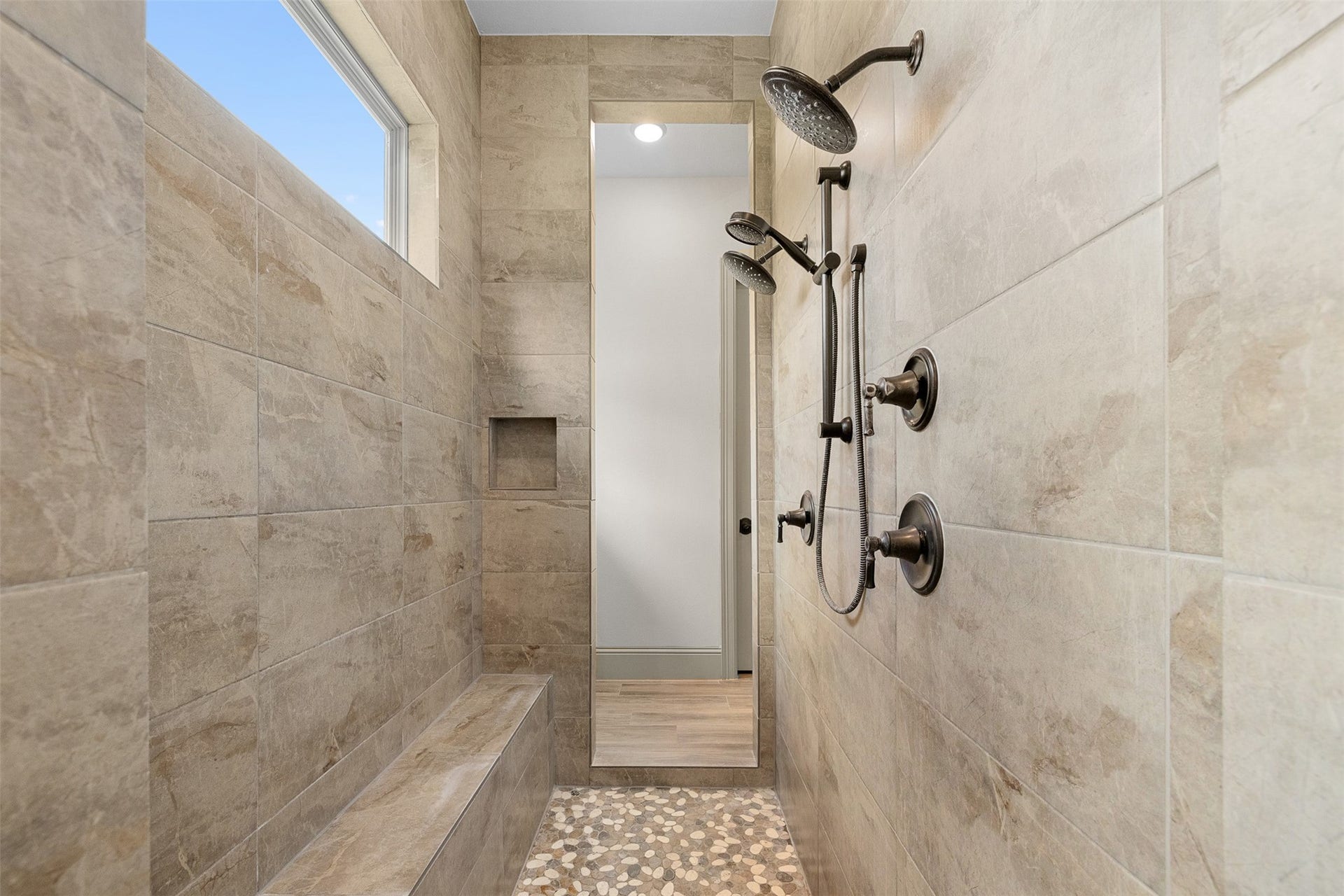 8603 Woods Hollow Trail, Fulshear, TX 77406 Double shower heads and an additional handheld in the walk through shower.