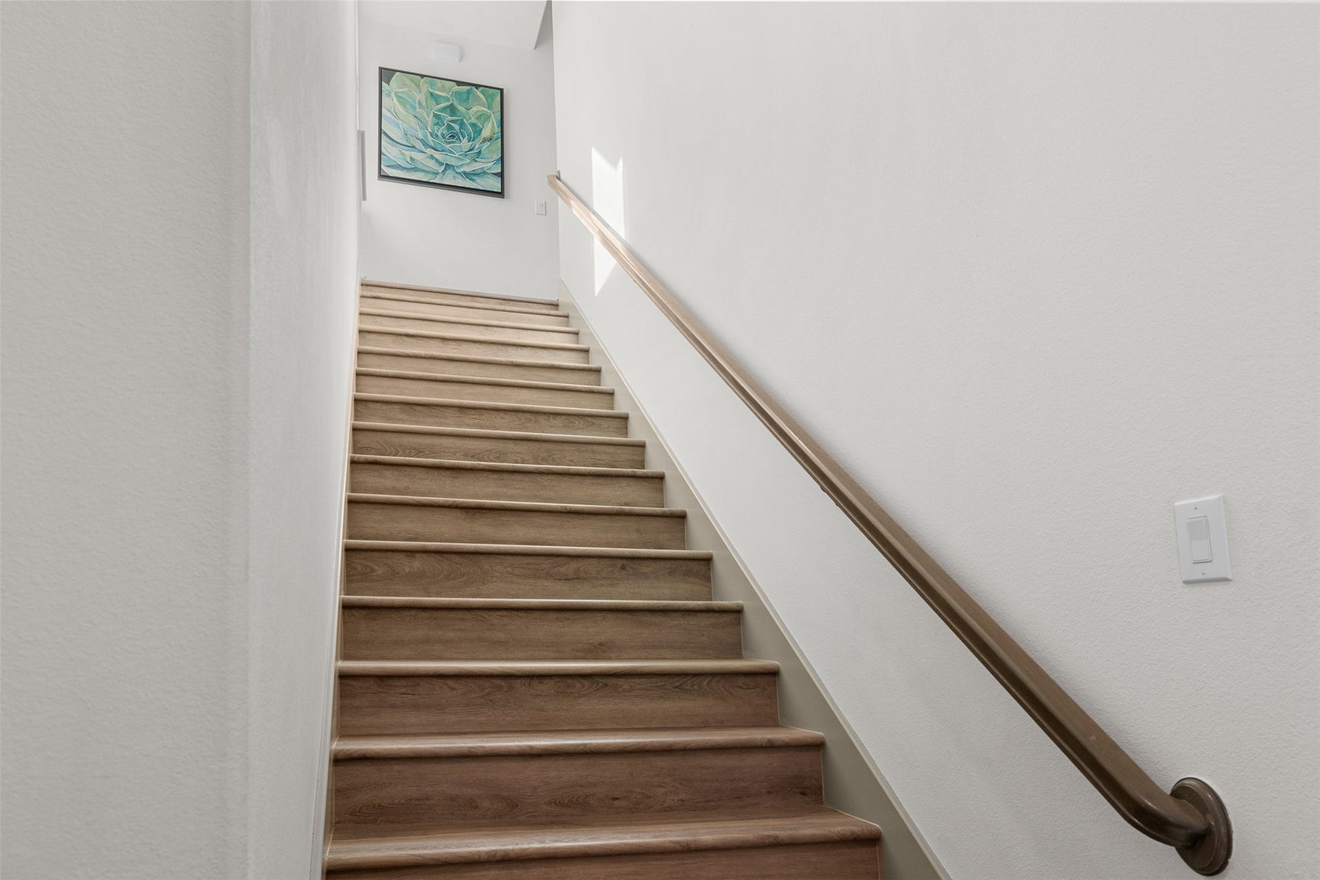 8603 Woods Hollow Trail, Fulshear, TX 77406 Stairs from the mud room entry lead to the secondary bedrooms.