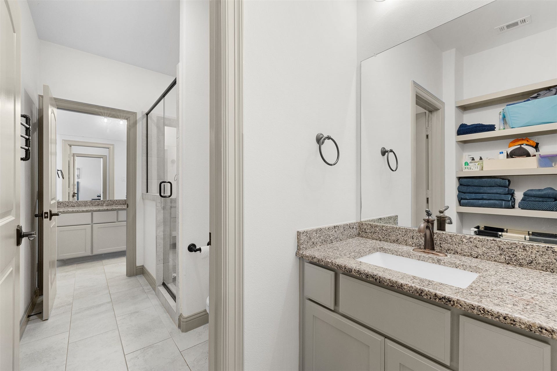 8603 Woods Hollow Trail, Fulshear, TX 77406 Shared shower - each bedroom has its own sink and storage.