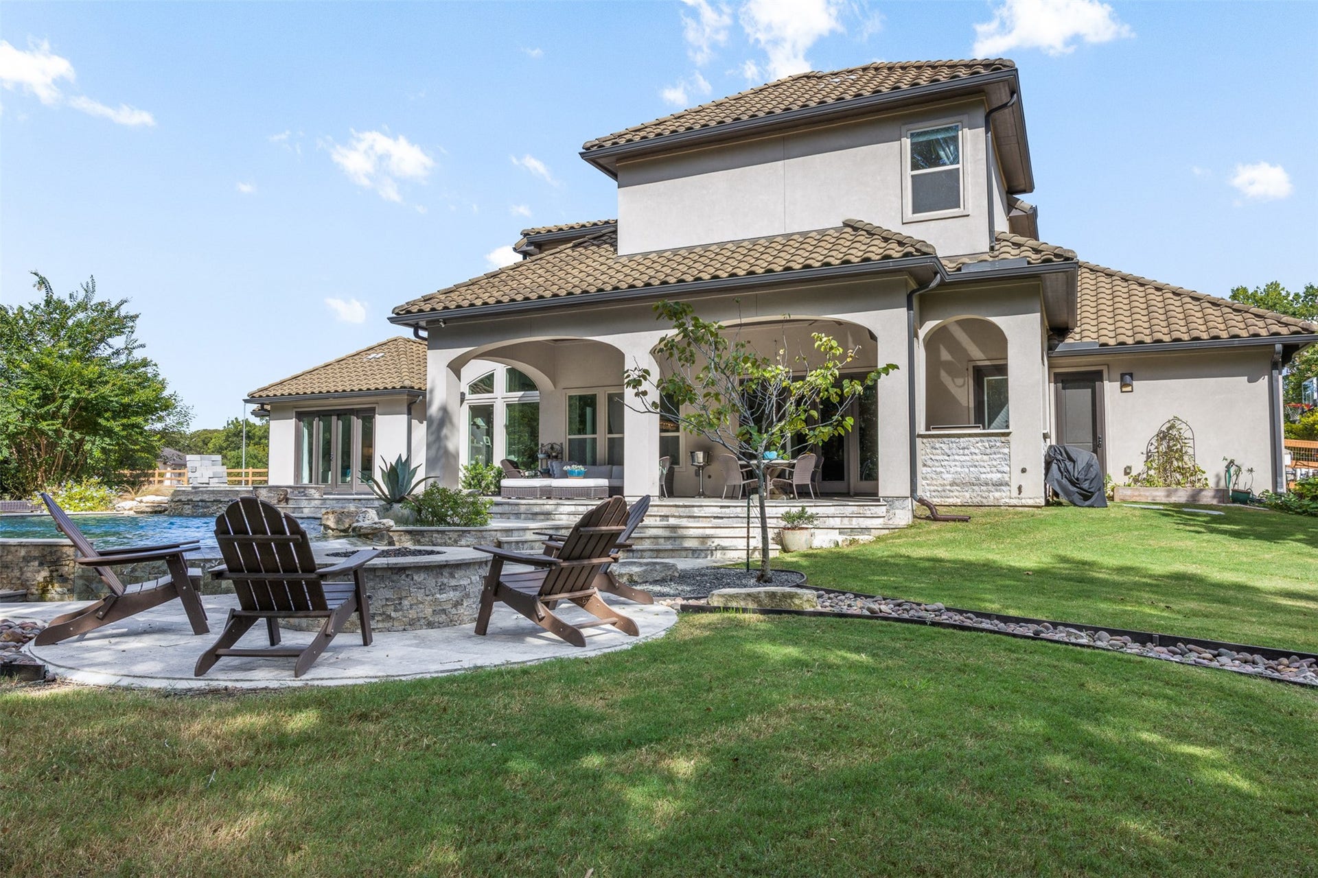 8603 Woods Hollow Trail, Fulshear, TX 77406 Firepit and dry rock creek