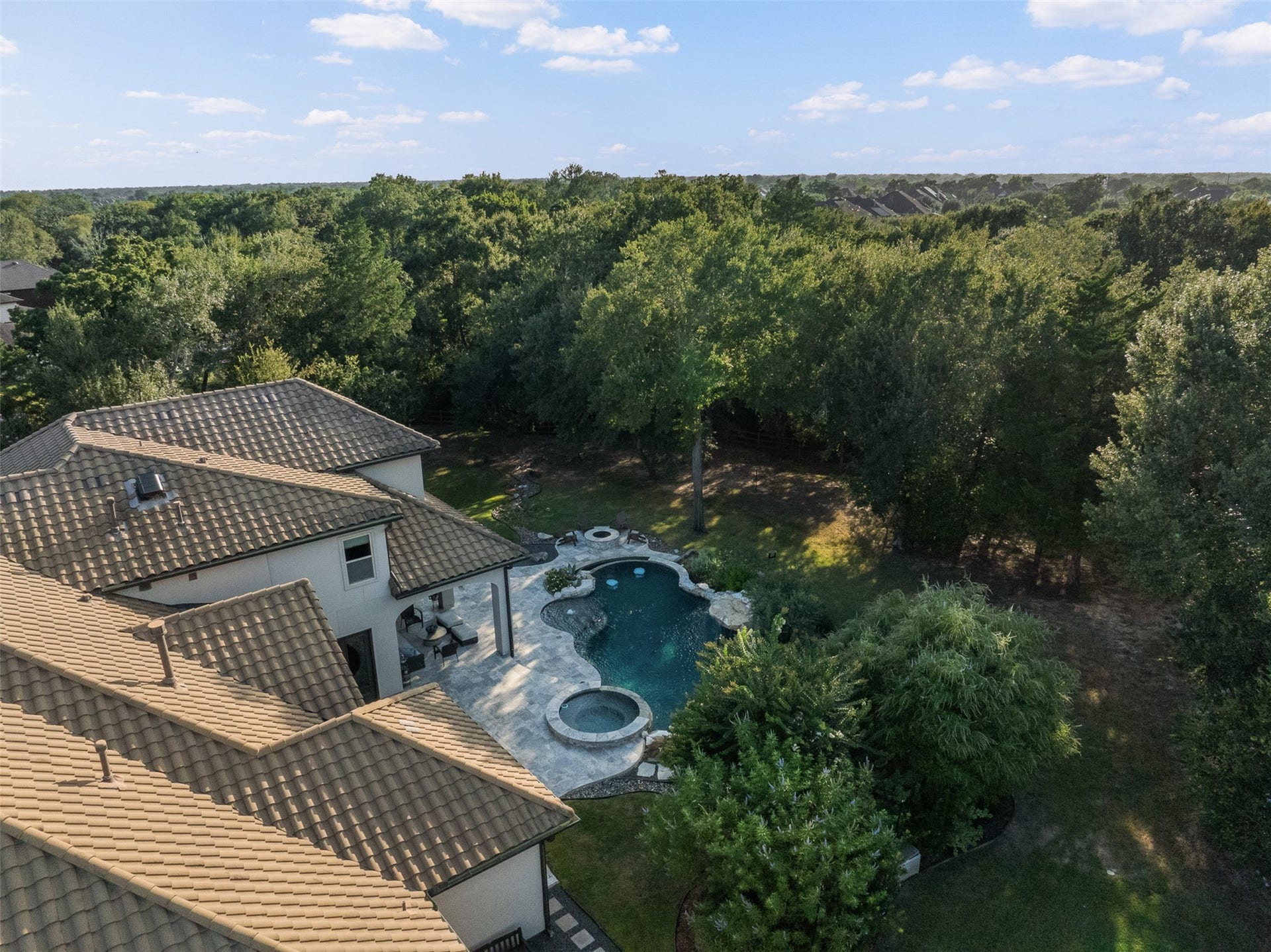 8603 Woods Hollow Trail, Fulshear, TX 77406 Class 3 hail rated concrete tile roof. The pool has sun mid-day and is shaded in the afternoon.