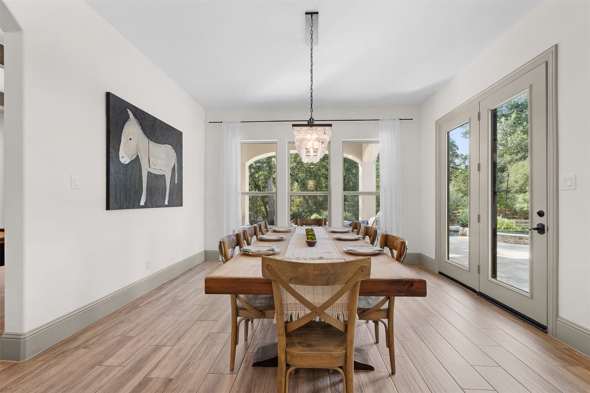 8603 Woods Hollow Trail, Fulshear, TX 77406 Large informal dining room is bathed in light.
