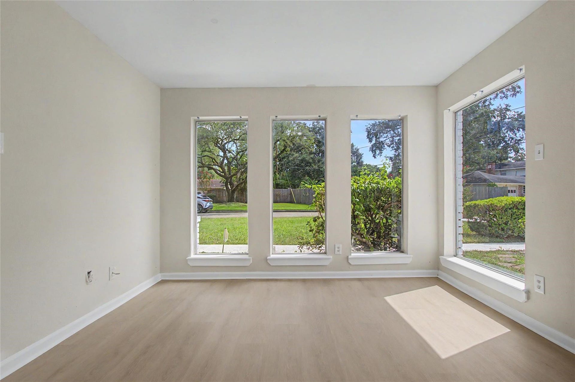 414 N Pecan Dr, Tomball, TX 77375 Formal dining room, with luxury vinyl flooring, fresh paint and abundant natural light