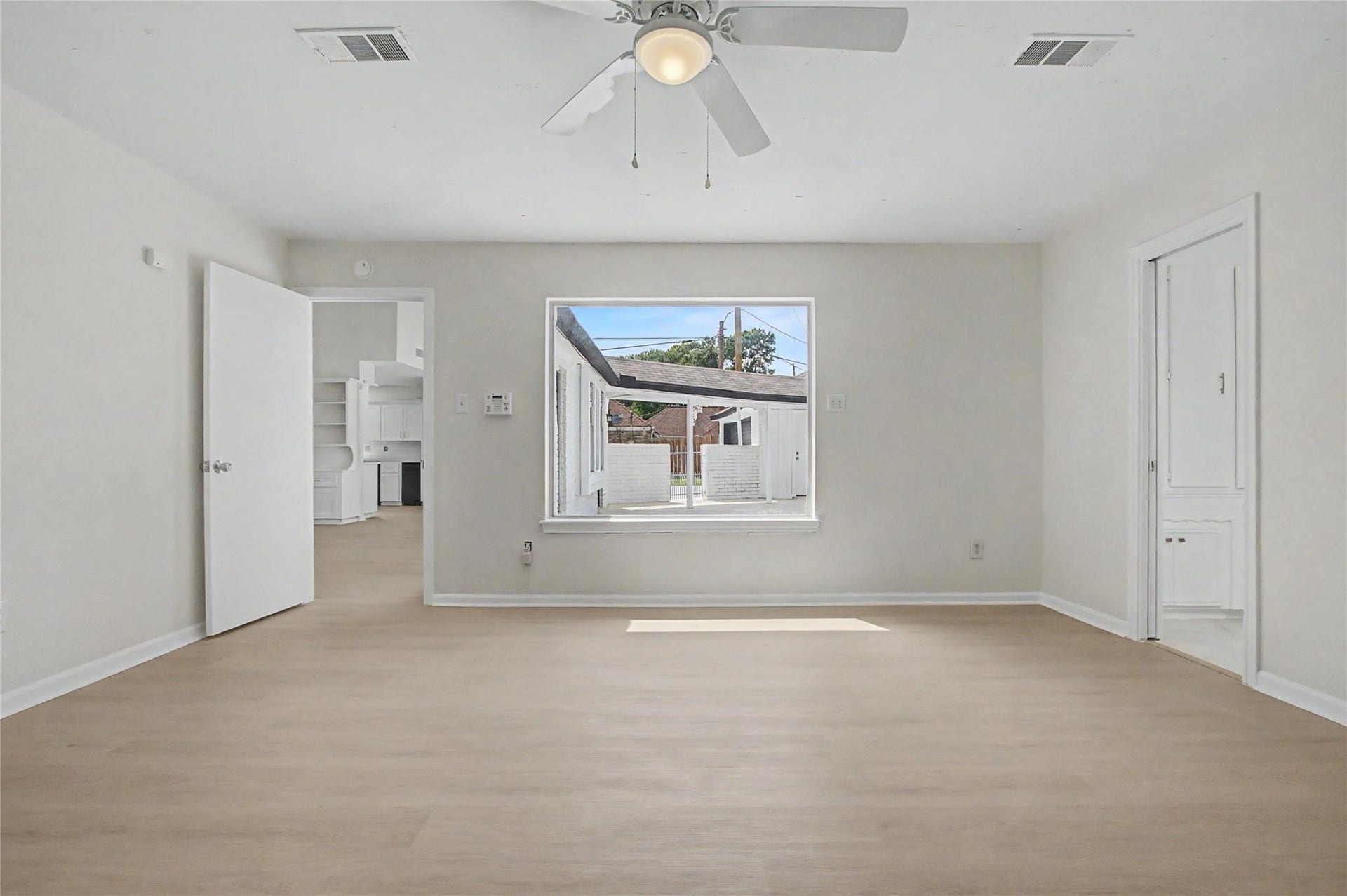 414 N Pecan Dr, Tomball, TX 77375 Primary bedroom featuring fresh paint, new luxury vinyl plank flooring, and abundant natural light.