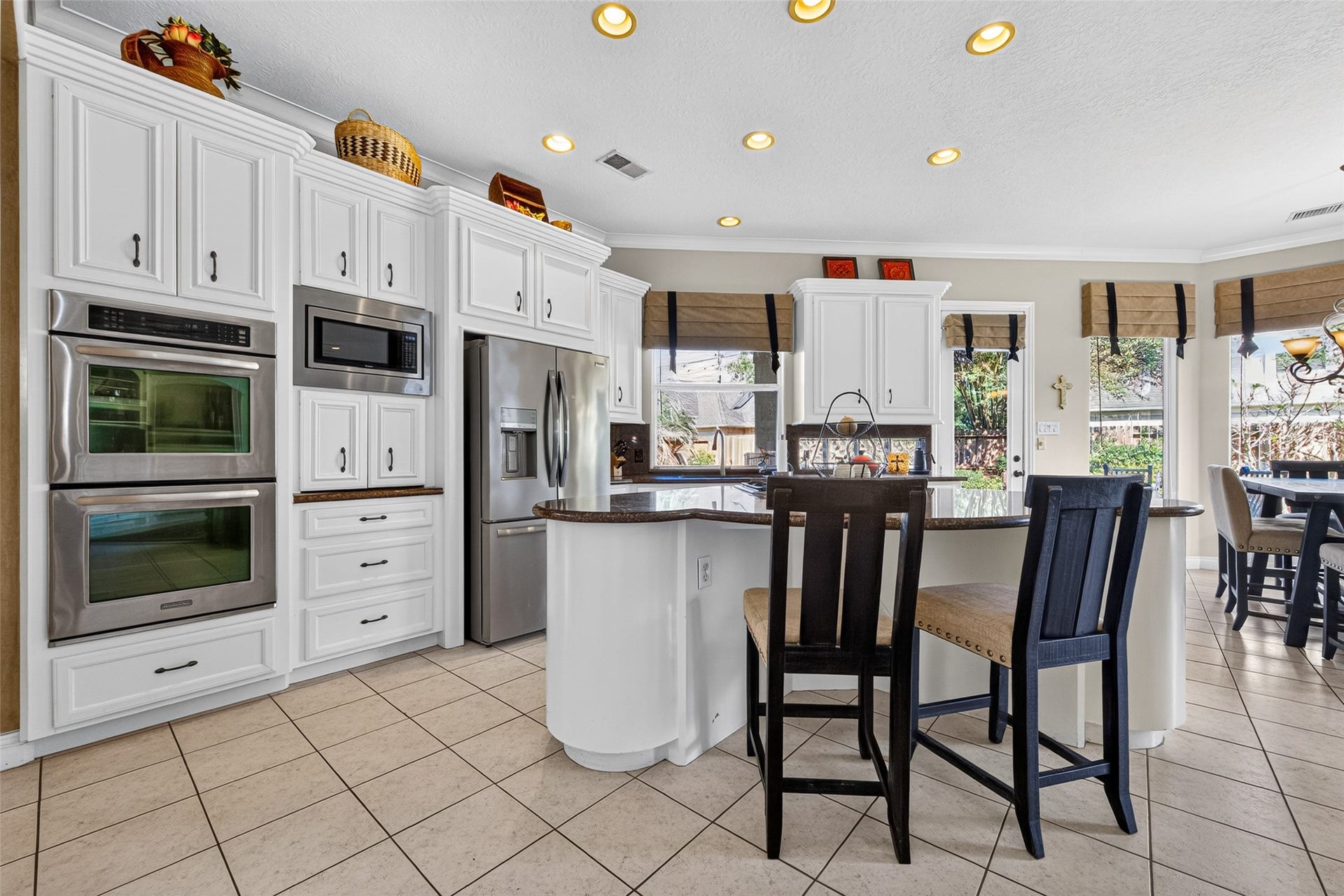 The large island makes the kitchen the heart of the home.  Prepare meals, dine or entertain...the choice is yours!
