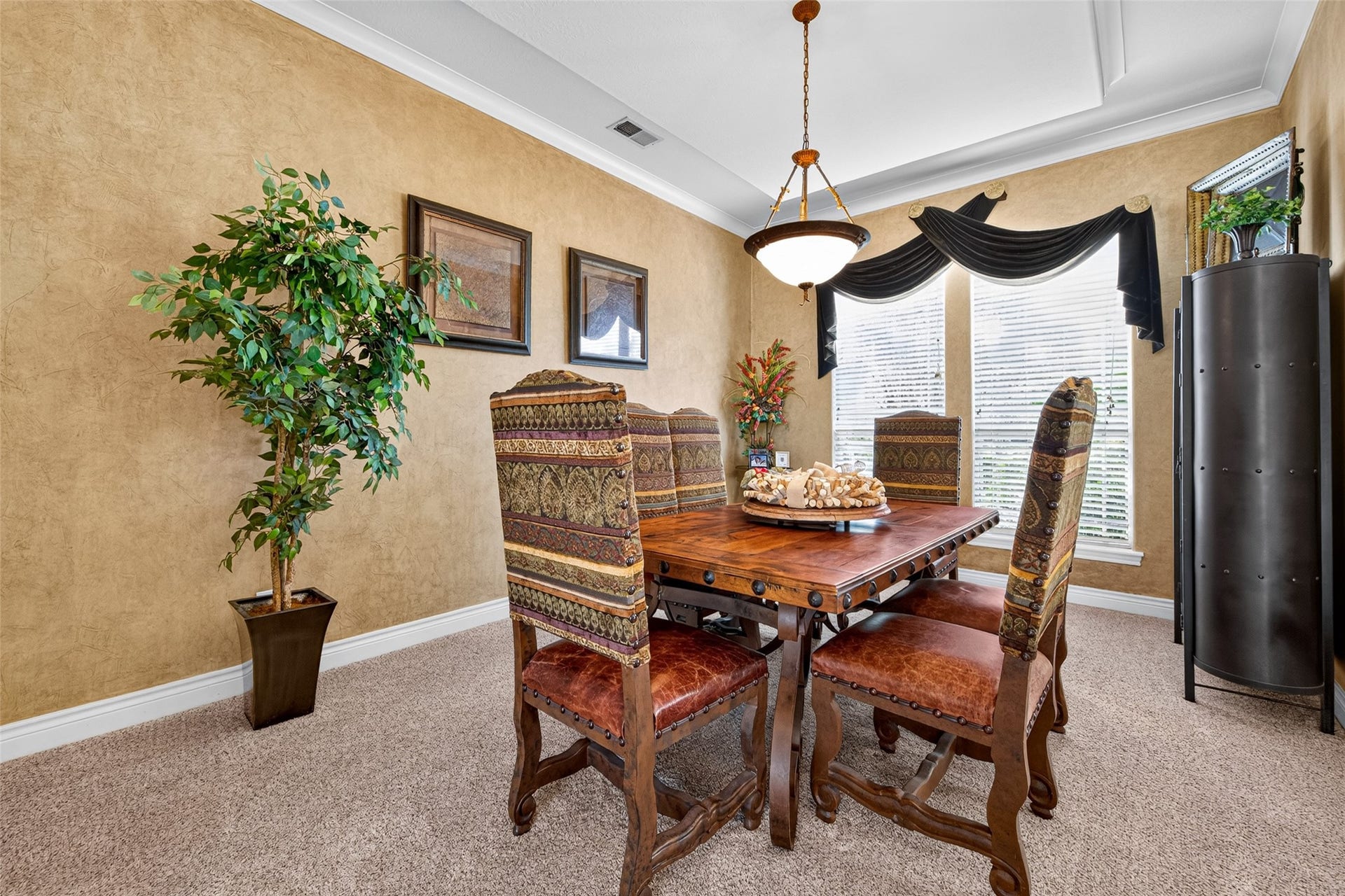 The formal dining room is ideal for gatherings large or small, formal or informal