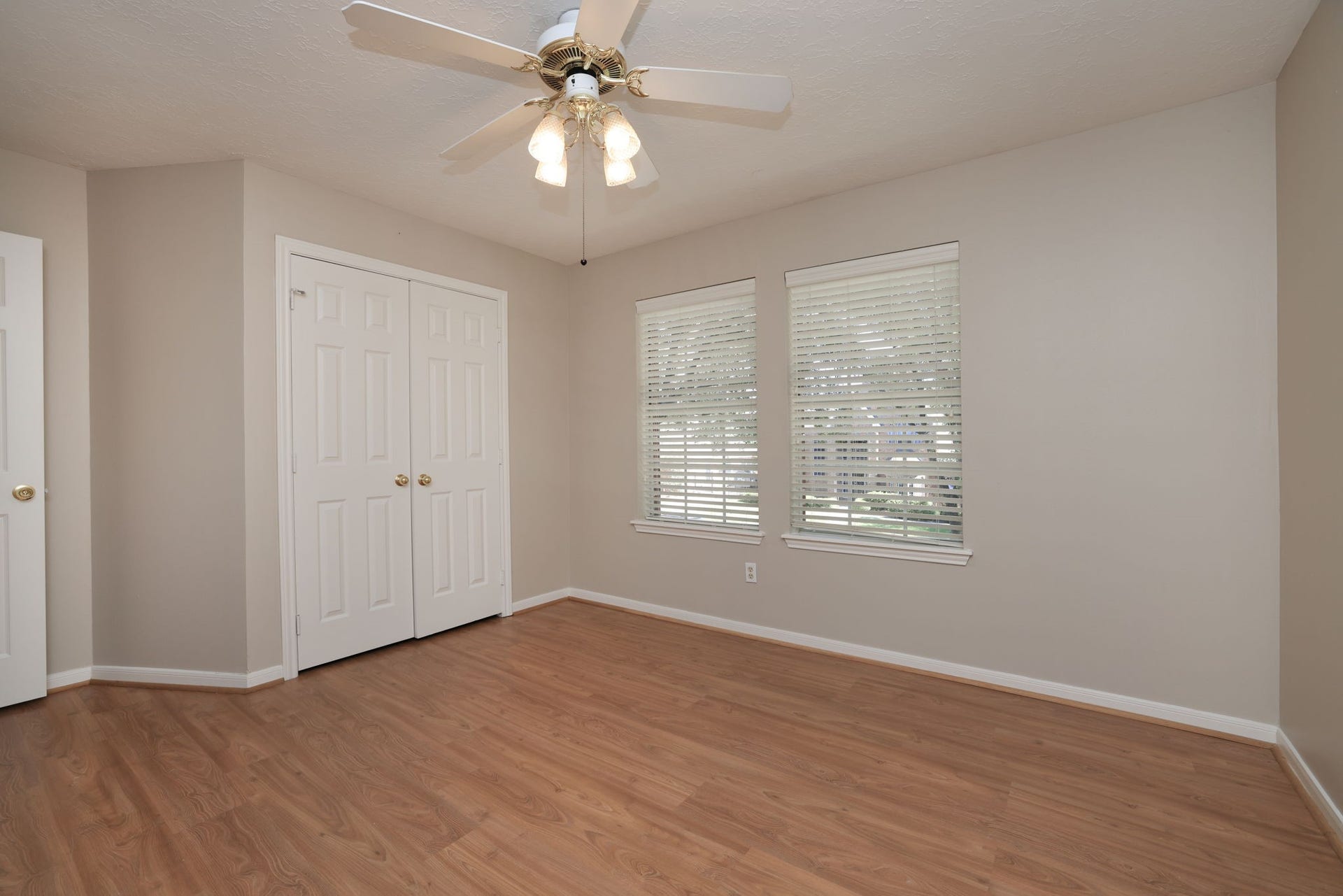 16107 Abberton Hill Drive, Spring, TX 77379 Spacious second upstairs bedroom with double closets and peaceful front yard views.