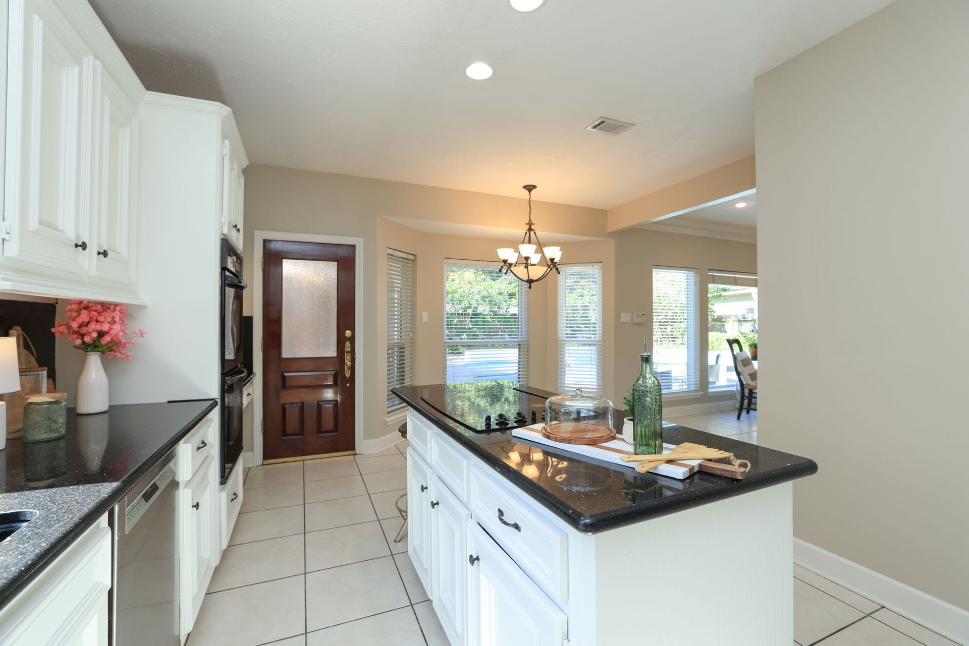 16107 Abberton Hill Drive, Spring, TX 77379 Spacious kitchen with center island and bright breakfast nook overlooking the pool and patio area.