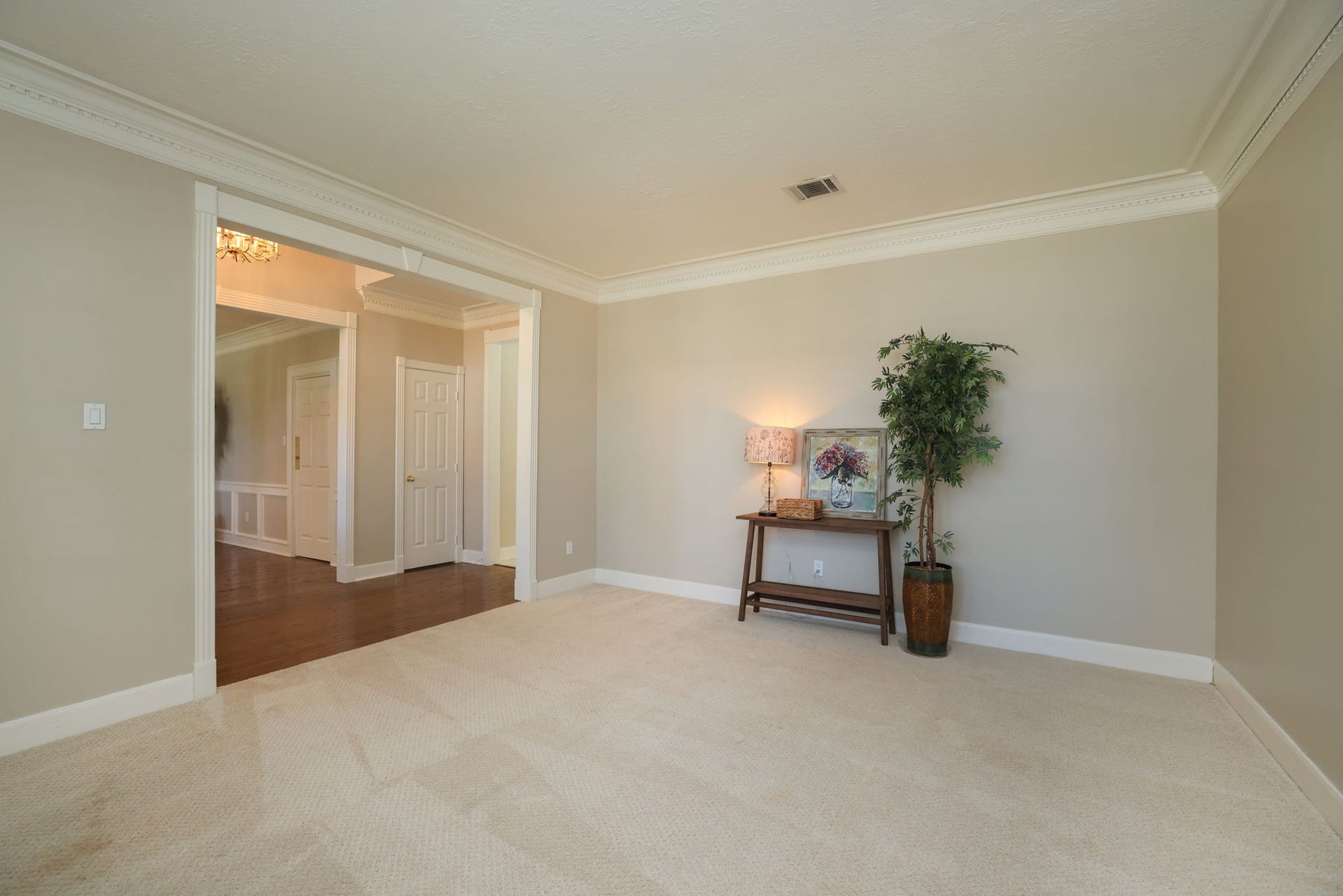 16107 Abberton Hill Drive, Spring, TX 77379 Spacious formal living area or study with soft neutral tones, crown molding, and views toward the grand foyer.