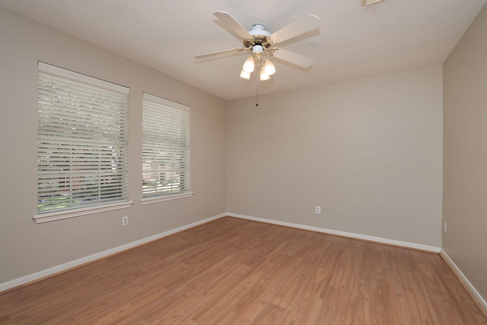 16107 Abberton Hill Drive, Spring, TX 77379 Light and airy with updated flooring, ceiling fan, and soft neutral color palette.