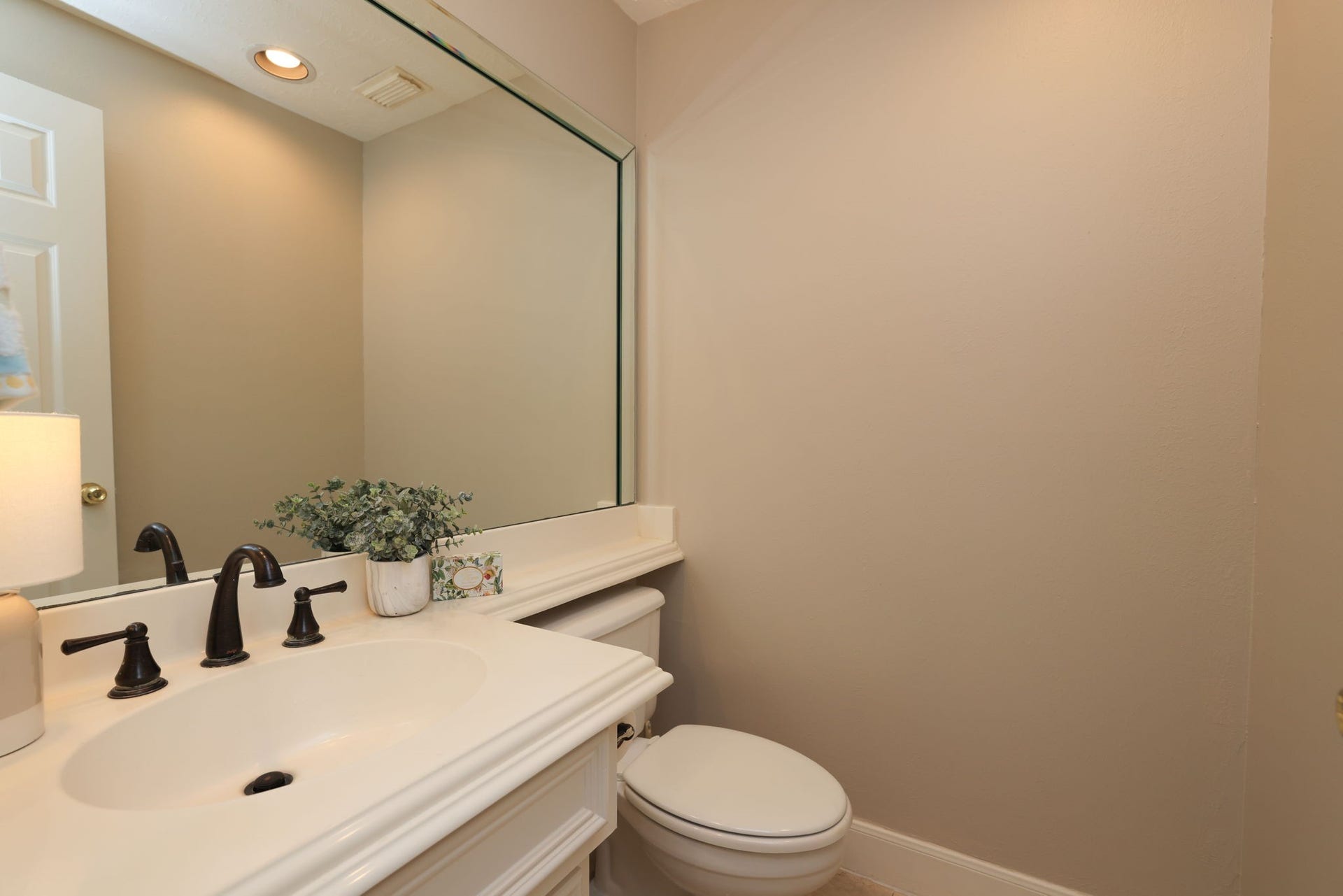 16107 Abberton Hill Drive, Spring, TX 77379 Charming powder bath on the main floor with updated fixtures and framed mirror.