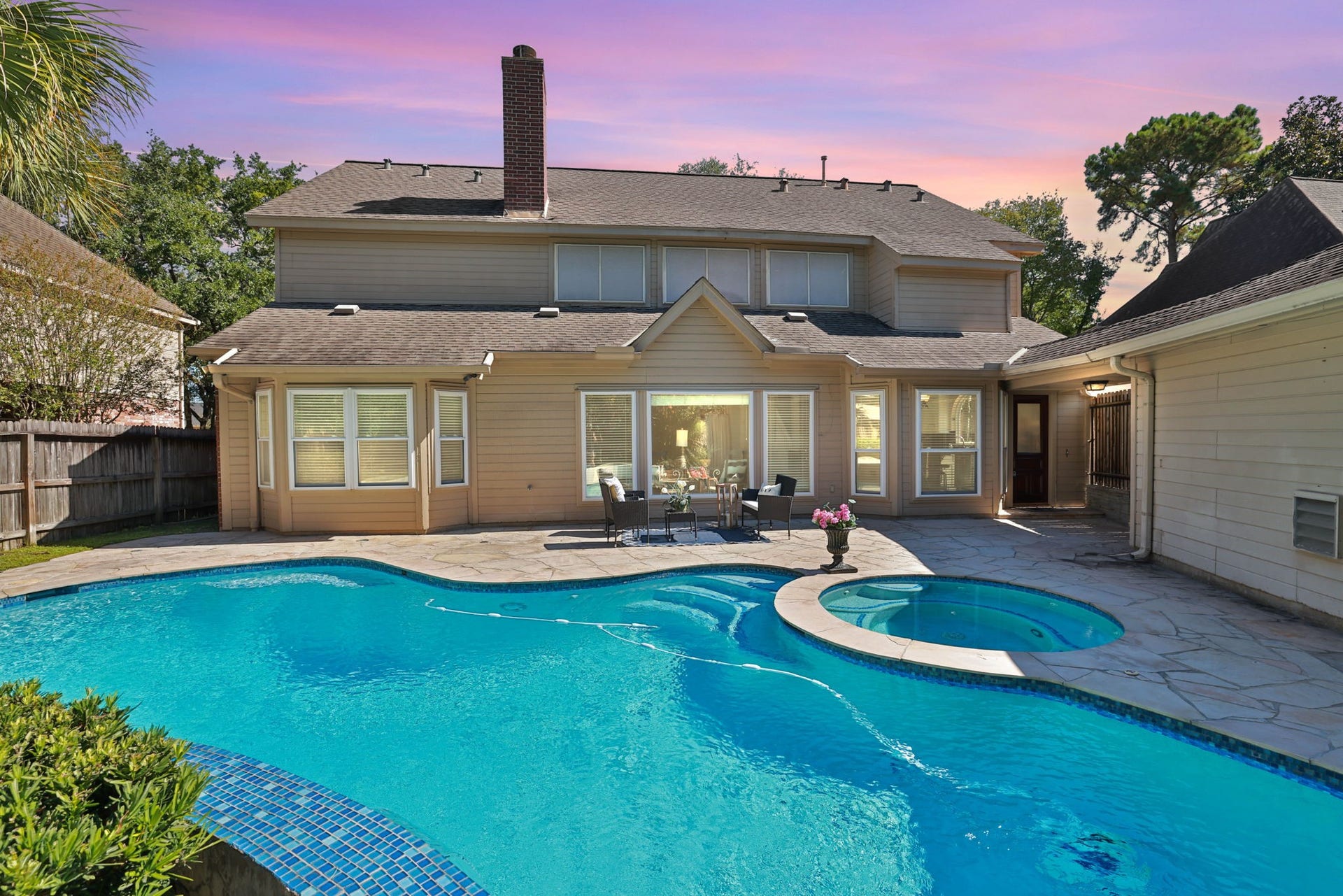 16107 Abberton Hill Drive, Spring, TX 77379 Beautiful remodeled pool with spa and waterfall in this 5 bedroom home.