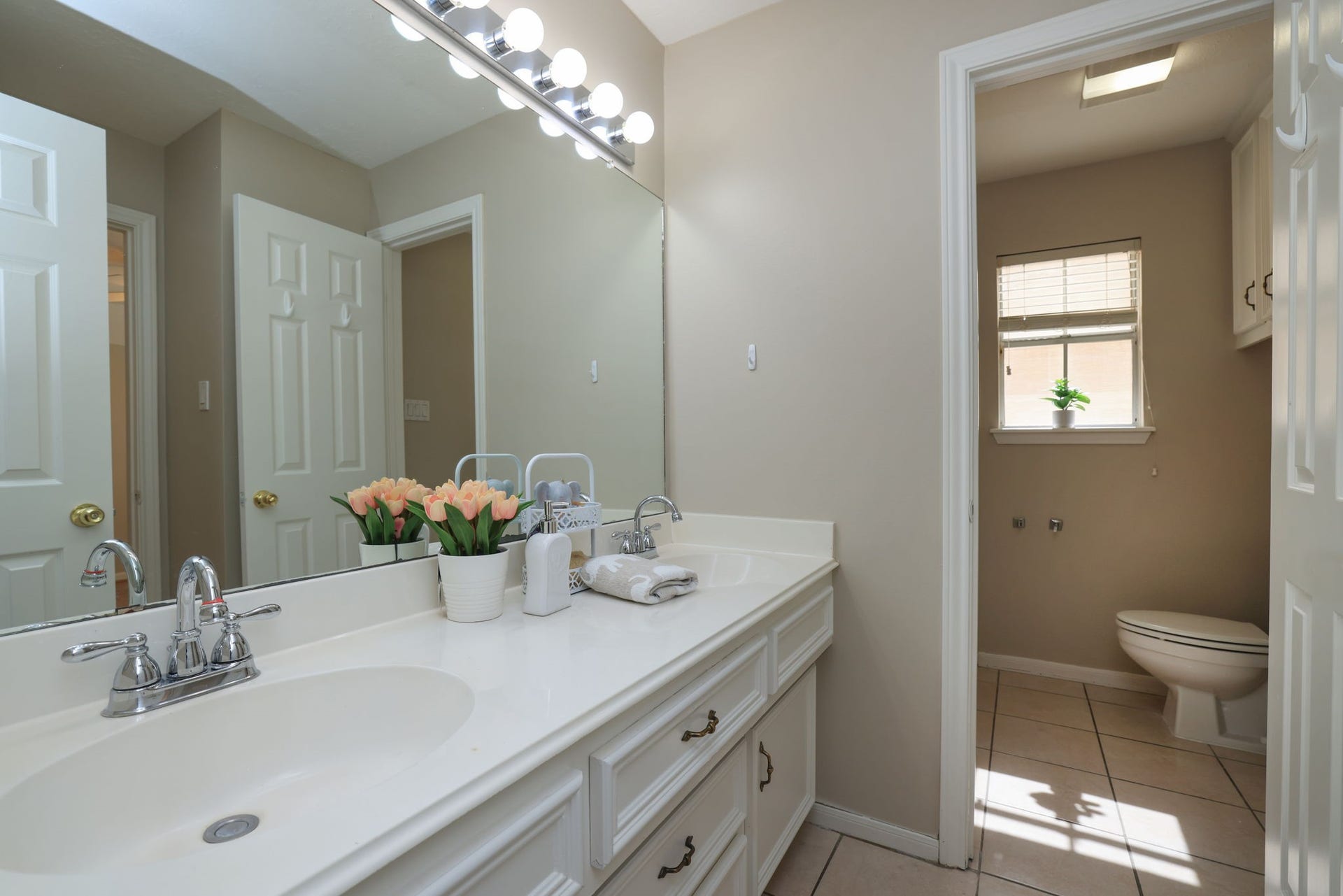 16107 Abberton Hill Drive, Spring, TX 77379 Large Upstairs bath with dual sinks, extended vanity, and separate area for shower and commode.